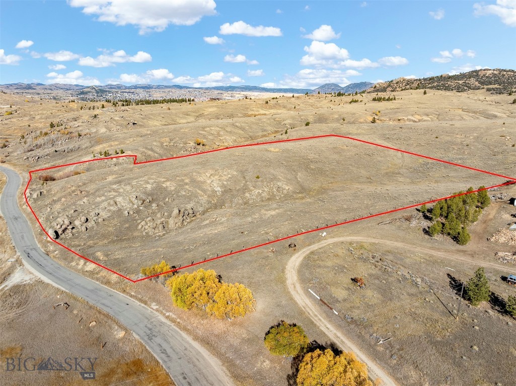 Discover the perfect blend of convenience and serenity on this +/-11 acre parcel, just minutes from town yet surrounded by wide-open Montana beauty. Access is fully paved, offering ease year-round, and the property features a prime elevated building site with sweeping views of the mountains, valleys, and surrounding landscape. Whether you’re envisioning a custom home or private retreat, this parcel offers the space and setting to bring your vision to life. Power is nearby, and the location provides the ideal balance of rural privacy with quick access to amenities, dining, and schools. Enjoy quiet mornings, endless skies, and room to roam, all within minutes of town. ***Property lines on photos are approximate.