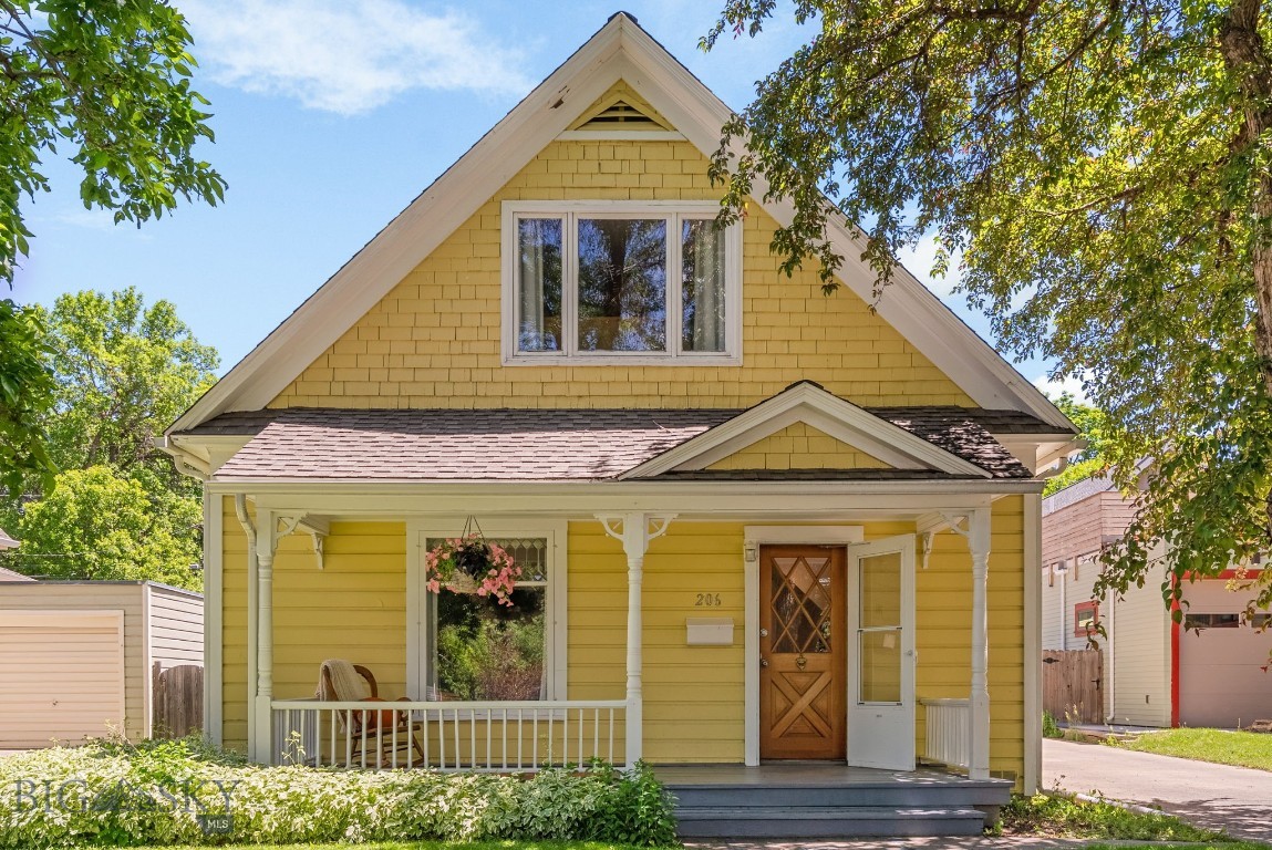 With its buttercup-yellow exterior, inviting front porch, original hardwood floors, and clawfoot bathtub, this downtown Victorian is the kind of home that immediately captures your heart. Full of warmth, character, and timeless appeal, it offers a rare opportunity to own a piece of Bozeman's architectural history without sacrificing modern comfort. Over the years, the home has been thoughtfully updated with a careful eye toward preserving its historic charm. Original details have been celebrated rather than replaced, creating a living experience that feels both authentic and move-in ready. The location is equally compelling; situated less than two blocks from Cooper Park and just four blocks from the Community Food Co-op, you'll enjoy the convenience of leaving your car behind and embracing one of Bozeman's most beloved neighborhoods. Morning walks for coffee, afternoons in the park, and evenings downtown are all just moments from your front door. Inside, the home offers four bedrooms, while the finished 450-square-foot space above the detached heated garage provides endless flexibility. Whether you're dreaming of guest quarters, a home office, creative studio, fitness space, or exploring the potential for a future ADU, this bonus area opens the door to countless possibilities. Historic charm, modern convenience, flexible living space, and an unbeatable downtown location—206 S. 7th Avenue embodies the very best of the Bozeman lifestyle.