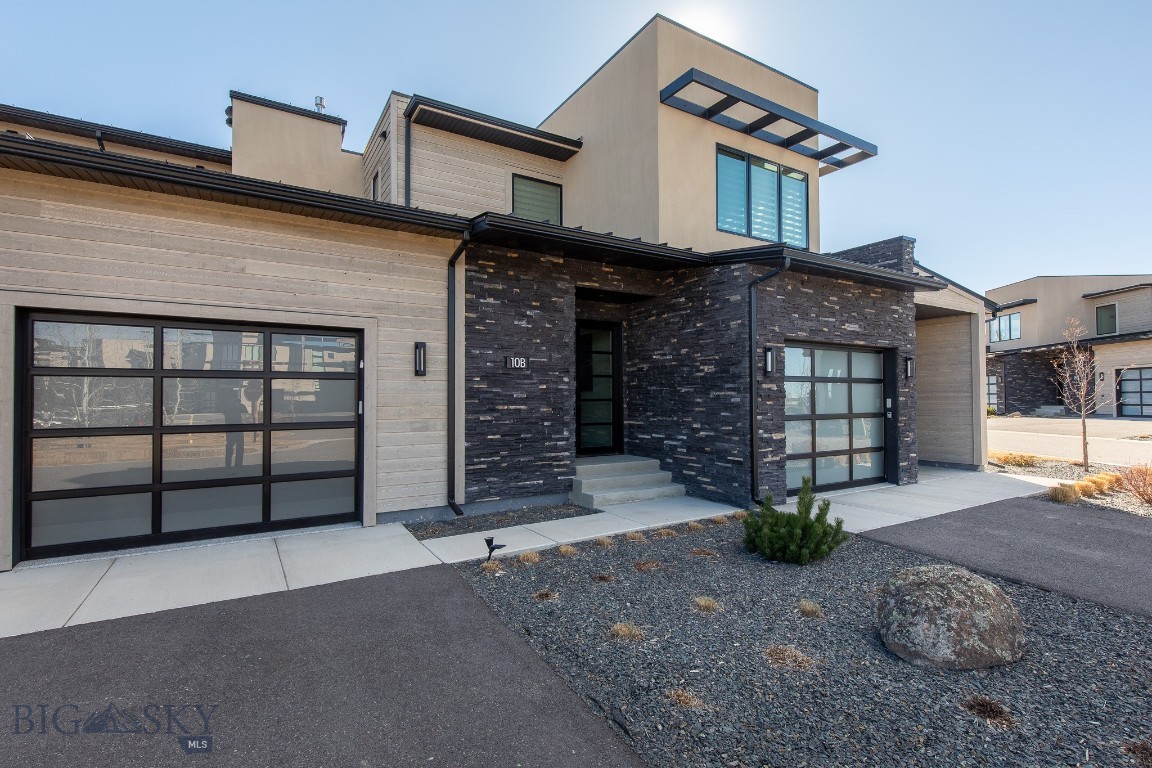 Welcome to effortless luxury living inside Bozeman’s premier private golf community — Black Bull. Perfectly positioned in the Villas at Black Bull, this barely-lived-in ground-level residence offers refined finishes, abundant natural light, and true lock-and-leave convenience just minutes from downtown Bozeman and the airport.

Built in 2023 and thoughtfully designed, the home features two spacious primary suites and an open-concept layout that lives much larger than its footprint. Sunlight pours through south-facing windows into the living room and kitchen, highlighting clean modern lines and upscale materials throughout.

The chef’s kitchen anchors the home with a large quartz island, premium Thermador appliances, generous pantry storage, and a dedicated bar area complete with a beverage refrigerator — ideal for entertaining or everyday living. The adjoining living area centers around a cozy gas fireplace, creating a warm Montana retreat feel year-round.

Both bedrooms function as true primary suites, each with private bathrooms and excellent separation for guests or roommates. A convenient half-bath serves visitors while maintaining privacy in the suites.

Step outside to a spacious patio featuring an outdoor fireplace — perfect for summer evenings after golf, skiing, or hiking.

Furniture is negotiable. Call today to view this amazing property!