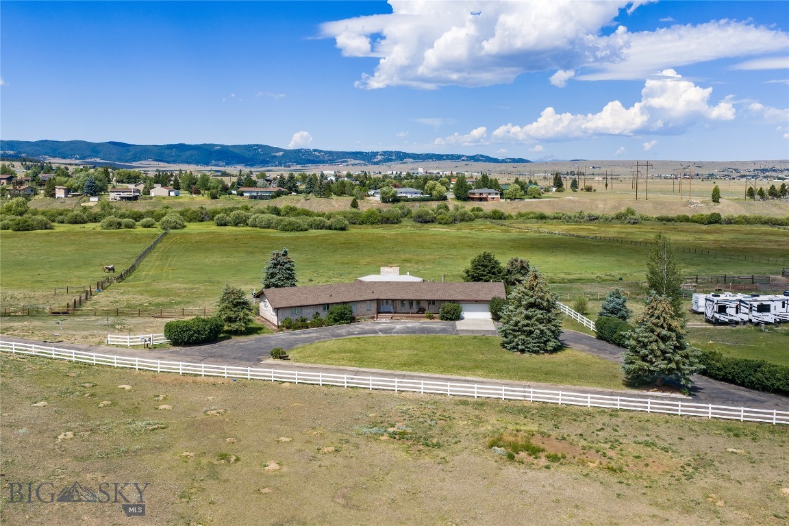 Rare in Town Horse Property on 23.43 Acres!
This 3-bedroom, 2-bathroom home sits on 23.43 acres and offers comfortable single-level living. The entry opens to a sunken living room with a gas fireplace and large windows overlooking the property. The kitchen and dining area flow together, creating an open space filled with natural light. Just off the living room, the tiled sunroom provides additional living space and year round views of the property.
The primary suite features a spacious walk-in closet and private bathroom with direct access to the oversized laundry room for added convenience.
Outside, the fenced pasture is ready for horses! The property also includes a heated 2-car attached garage, a 40x60 insulated pole barn with power, a 4-stall barn with tack and feed rooms, an RV pad with hookups, and two wells.
If you