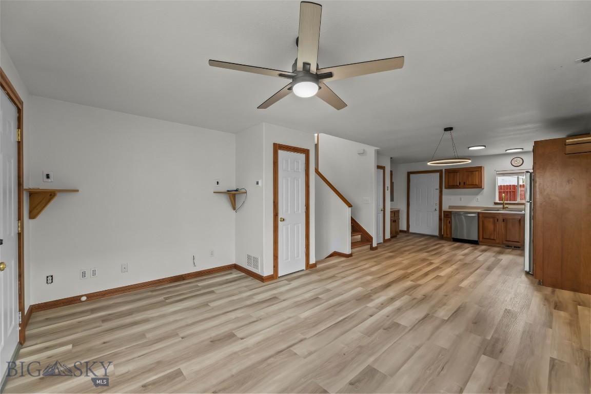 Renovated home nestled in the heart of Belgrade's popular River Rock Subdivision.   Bathrooms, bedrooms and the floors newly updated along with landscaping and new paint through out. This enchanting 4-bedroom, 2-bathroom tri-level residence spans 1,440 sq ft, offering a harmonious blend of comfort and style. The home also includes a separate, private retreat with 6 person Hot Tub for soaking after a long day! The River Rock community boasts an 8-acre lake, meandering walking trails, business district, highly sought after Ridge View Elementary School, expansive parks, all creating a serene backdrop for your daily life. Located just outside the vibrant city limits of Belgrade, Montana's eighth-largest city, this home provides the perfect balance of small-town charm and modern conveniences. With its thoughtfully designed layout and prime location, this property promises a lifestyle of tranquility and accessibility. Opportunities like this are rare and fleeting—seize the chance to make this captivating residence your own before it's gone.