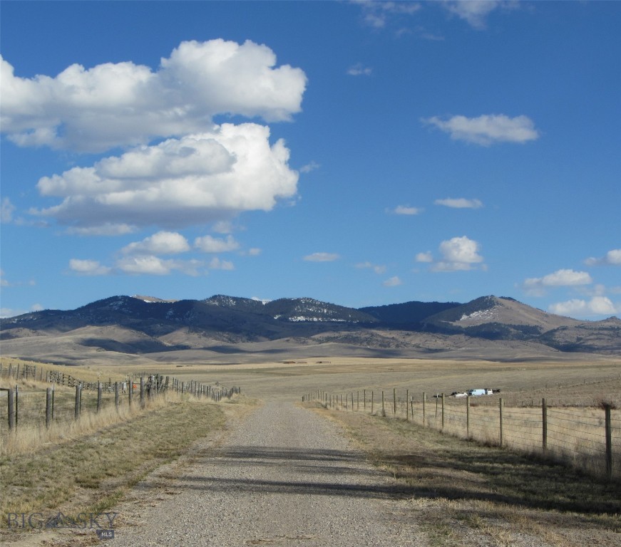 Build Your Montana Dream Home on 10 Acres of Possibility
Build your dream home while enjoying on-site amenities. This 10-acre potential horse property offers the perfect foundation to create your dream Montana retreat. With essential infrastructure already in place — electricity, a reliable high-producing well, and septic — you can start right away. A charming 1,100 sq ft log cabin guest house and an impressive 4,800 sq ft MQS metal shop building with RV door adds tremendous value, flexibility, and comfort from day one.
The inviting log cabin has previously served as a primary residence and features open floor plan with abundant natural light, one-bedroom, full bath, and kitchenette, washer/dryer included, luxury plank flooring and tongue-and-groove ceilings, three exterior doors and numerous windows for airflow and brightness, large front deck overlooking peaceful Montana views, and back deck ideal for relaxing or entertaining. The cabin is perfect as a guest house, temporary living quarters while you build, or a cozy full-time residence.
Just steps from the cabin sits a versatile 4800 sq ft shop building offering 800 sq ft climate-controlled living space (or premium storage) with full bathroom, large loft for additional storage or creative use, an expansive open shop area ideal for equipment, hobbies, or even a business venture. This building provides endless possibilities — workshop, home business, RV storage, guest accommodations, or all of the above.
The property also includes: three additional storage sheds, all generously sized with one shed insulated with electricity, perfect for freezers, refrigerators, or workspace.
With flat, usable land, this property is ideal for horses or large animals, gardening or homesteading, expanding living space. Located just minutes from Dillon and Barrett Hospital, you’ll enjoy the rare combination of privacy, space, and convenience.