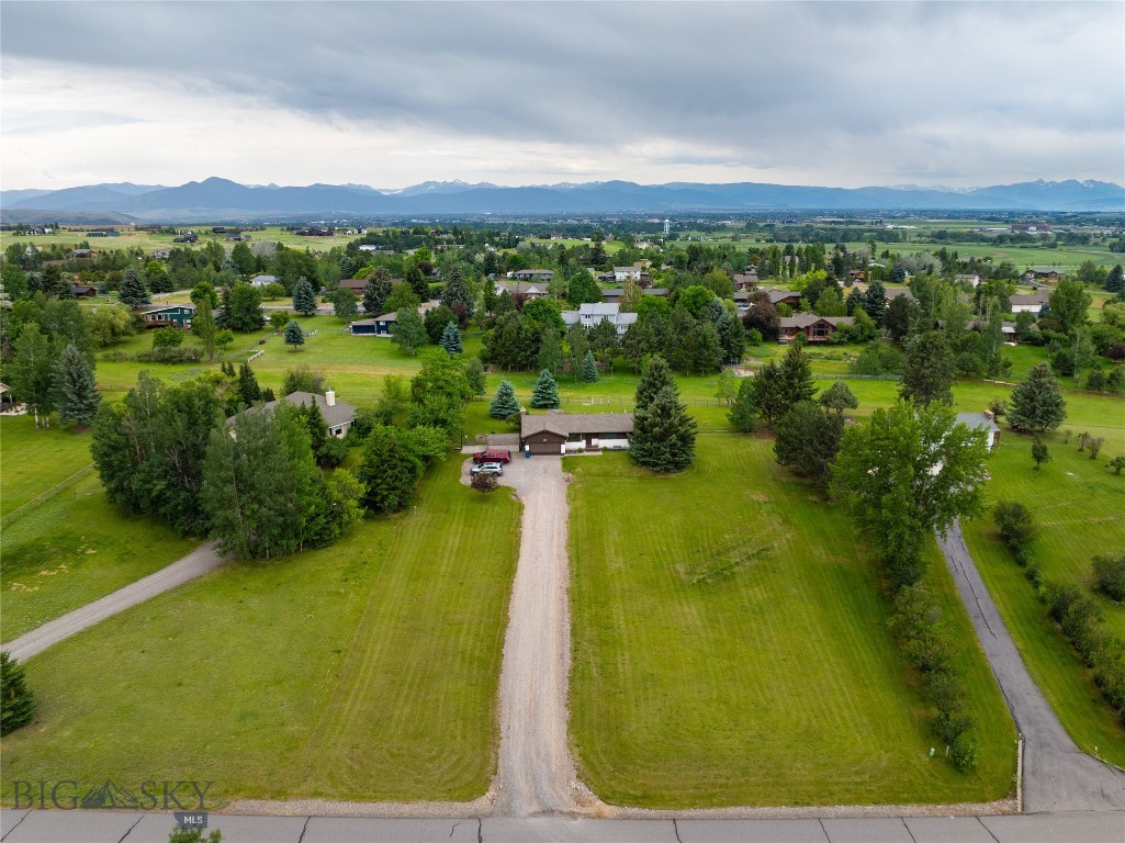 Privacy and views, what more could you ask for. This home is waiting for the right person to come along and bring it up to the present. The property has been lovingly lived in and now it's time for the next phase of it's life. Relax in the main level family room and enjoy the gas fireplace while sitting back and reading or watching TV. From the spacious kitchen you can enjoy views of the back yard. The sitting room in the front gives you wonderful views of the Bridgers. The basement level offers a family room and 2 bedrooms that do not have egress windows and plenty of storage. The back patio gives you a relaxing outdoor space to entertain or just relax. All this plus you are only about 20 minutes from Yellowstone International Airport or all the great shopping and restaurants in Bozeman.