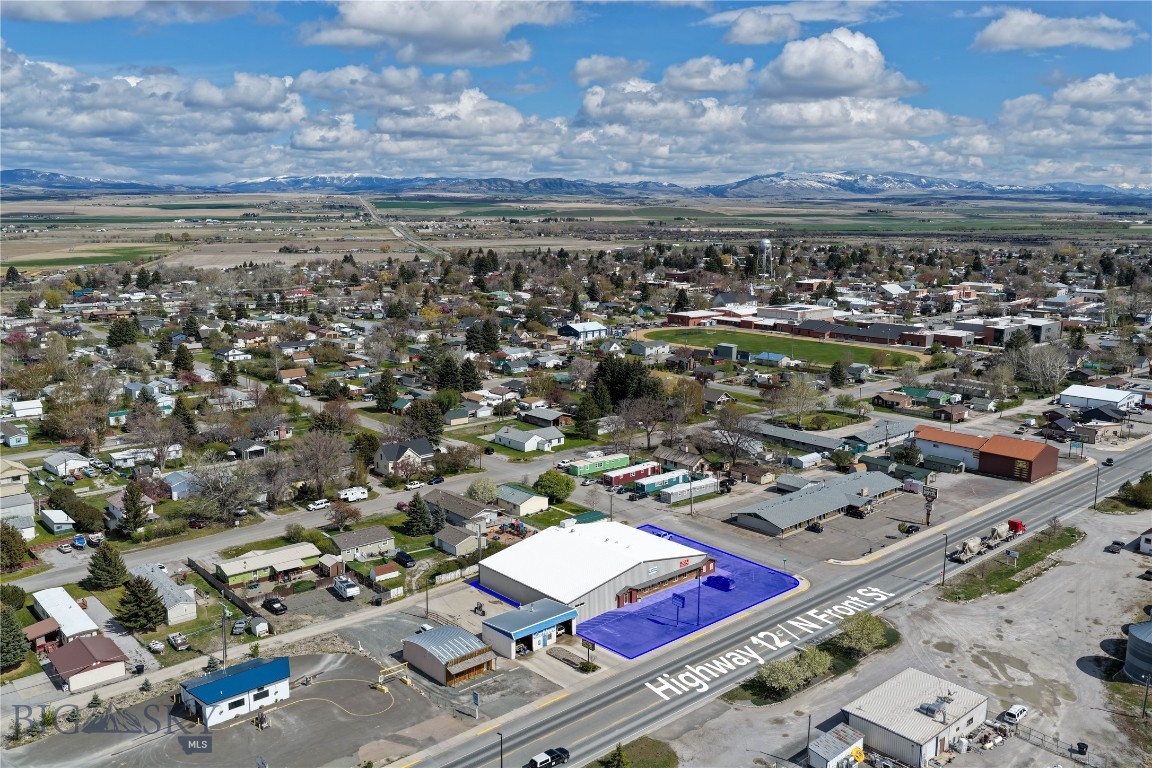 Highway 12 exposure is hard to beat. 500 N Front Street in Townsend offers 12,426 sqft of commercial space on .489 acres inside city limits, with over 20 parking spaces and multiple established businesses already in place. The building is home to Kickstart Nutrition, V42 Fitness, a massage space, and wrestling space used by Townsend Bulldogs Wrestling and youth programs, with room to expand. Inside are men’s and women’s ADA locker rooms with toilets, showers, sinks, and changing areas that connect to both the gym and wrestling side. The wrestling area also includes a private office, bathroom, storage closet, and open mat space. Upstairs has a shared laundry room, utility room, and owner storage. Built in 2012 with AC and a solid HVAC system, all set up in a high-traffic location. Come take a look!