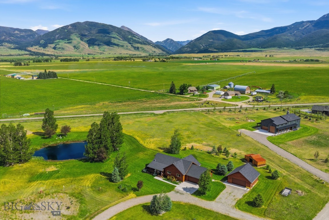 Now is your chance to not only own this peaceful pond-front retreat, but also the adjoining lot! This home offers pond frontage with the kind of scenic views that make you want to slow down. And the location is a big win: you’re just minutes from Yellowstone River fishing access, with Chico Hot Springs, Sage Lodge, and The Old Saloon nearby for easy fun and local charm and you’re only about an hour from Yellowstone National Park, so weekend adventures are always within reach.

Step inside to open-concept living areas that naturally draw your eyes to the stunning mountain views beyond, beautiful by day and seriously cozy at night. The home is set up for single-level living, with the additional basement space serving as the perfect retreat for guests, hobbies, or a little extra breathing room. The basement is also where you’ll find the brand-new bedroom and bathroom, along with the already-existing upgrades that make this home feel ready from the start.

There’s plenty to love beyond the main rooms too. Some of the updates include a custom-built equipment barn, a water softener, an additional 1,000-gallon propane tank, and new trees for extra curb appeal. Plus, the oversized storage room has recently had sheetrock added for a more finished look—while still keeping the door open for future expansion if the next owners want to build it out further.

Best of all, the home is in immaculate condition, making it an excellent fit for either a vacation getaway or a comfortable year-round residence. Come see it and imagine how quickly this can become your favorite place to call home.