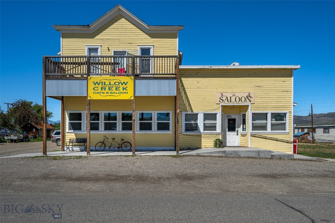 Own a true Montana landmark! The historic Willow Creek Cafe & Saloon has served as a community gathering place and destination restaurant for generations. Offered at $995,000, this iconic commercial property features approximately 5,760 square feet in a charming historic building dating to 1920, blending authentic character with exceptional business potential. The main level offers established restaurant and saloon space with a commercial kitchen, dining areas, and the timeless atmosphere that has made the Willow Creek Cafe a well-known stop for locals and travelers alike. Above the business is a spacious 3-bedroom, 1-bath apartment, providing an ideal owner-operator residence, employee housing, or additional rental income opportunity. Located in the heart of Willow Creek between Bozeman and Three Forks, this unique property benefits from regional tourism, outdoor recreation, and strong local recognition. Rich in history and Montana charm, the property presents a rare opportunity to continue a longstanding hospitality tradition or bring new vision to a beloved community landmark. Historic character, established presence, living quarters, an extra city lot to expand or build and endless potential, this is a chance to own one of Southwest Montana's most recognizable commercial properties.