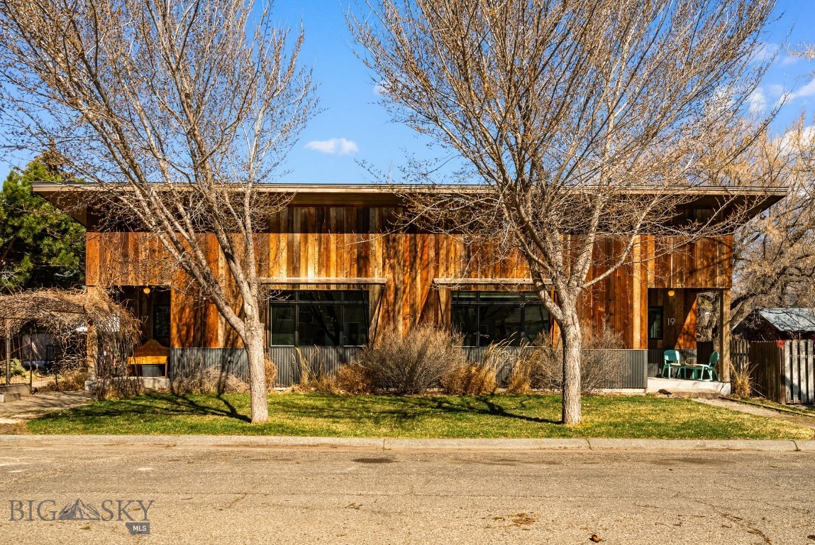 A rare opportunity to own a thoughtfully designed custom duplex in Northeast Bozeman, ideally located just minutes from Main Street and a block from Centennial Park. This architecturally distinctive property offers a seamless blend of modern design, functionality, and prime location—an exceptional combination that is increasingly hard to find.

Each unit has been carefully curated with a contemporary open-concept floor plan, featuring an integrated living and dining space that maximizes both comfort and efficiency. With one bedroom and one bathroom per unit, the layout is perfectly suited for full-time living, rental income, or a lock-and-leave lifestyle. The interiors are elevated by in-floor radiant heat in both the kitchens and bathrooms, creating a warm and inviting environment—especially appreciated during Montana’s colder months.

The exterior showcases a unique and refined aesthetic, combining reclaimed wood siding with corrugated metal wainscoting and custom cold-rolled steel awnings. This blend of materials not only enhances durability but also delivers a distinctive architectural presence that sets the property apart.

A spacious shared backyard provides ample room to relax, entertain, or enjoy Bozeman’s beautiful summer evenings, offering a sense of privacy and connection to the outdoors.

With immediate access to downtown Bozeman, nearby trails, and the gateway to Bridger Canyon just minutes away, this location supports both convenience and recreation. Whether you’re seeking an investment opportunity, a primary residence with income potential, or a flexible living arrangement, this one-of-a-kind property delivers versatility and long-term value.