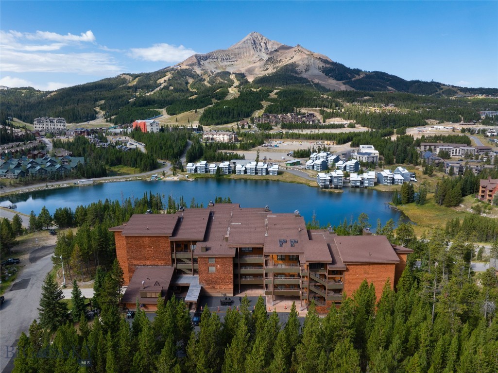 Incredible Lone Mountain views overlooking the world class Big Sky Resort. After a refreshing day of skiing, boarding, biking, hiking, fishing, a memorable day in Yellowstone National Park or many other Montana outdoor adventures; cozy in around a fire, a soak in your hot tub or quiet time on the balcony enjoying the evening sunsets.  This spacious 3BR/3B condo has two separate gathering areas. Underground heated parking with elevator access to your level. Conveniently located on the complimentary Big Sky shuttle route, enjoy easy access to Big Sky Resort and many mountain resort amenities.
