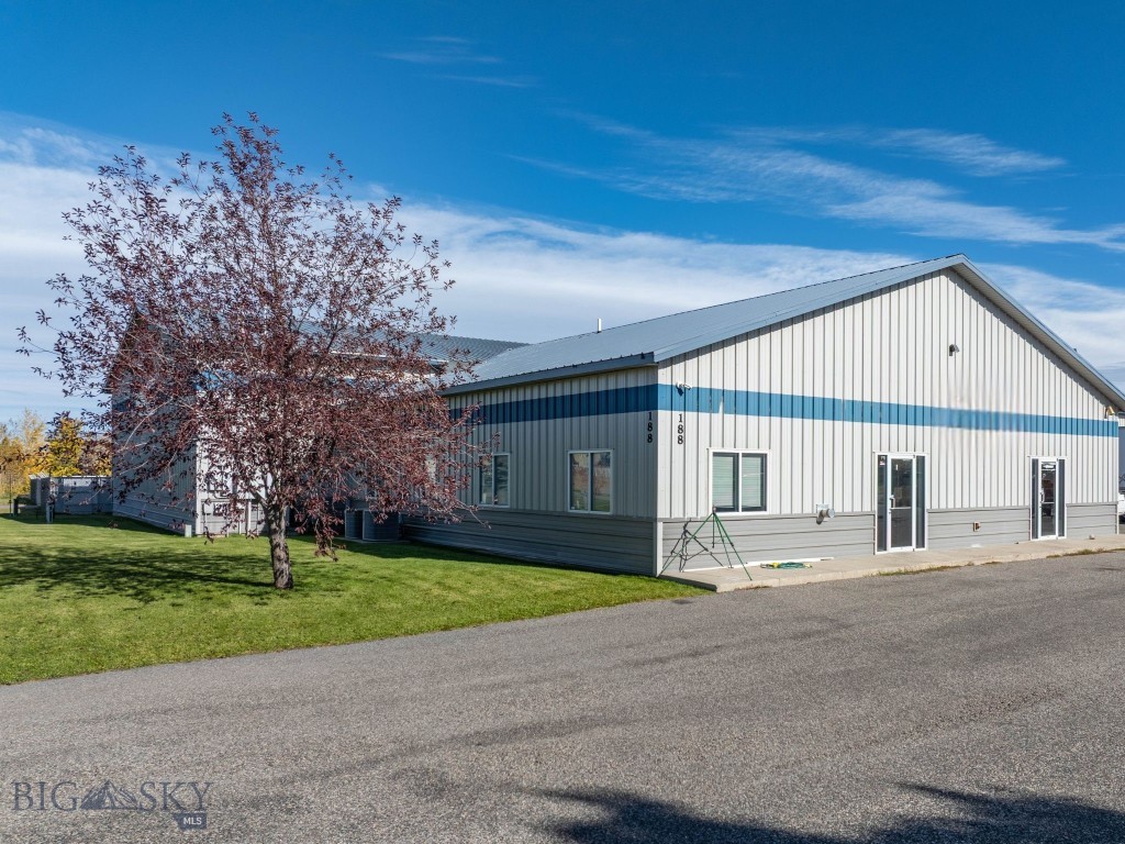 Built for durability and performance, this 18,500± SF metal-clad warehouse in Four Corners offers exceptional commercial functionality and a layout suited to both heavy operational use and customer-facing business. The building features two expansive warehouse bays measuring 144' x 60' and 100' x 70', each with 16'+ ceilings that accommodate efficient racking, equipment maneuverability, or large-scale production. A separate space ideal for a retail setup enhances versatility and provides a valuable opportunity for direct customer interaction.

Supporting spaces include two private offices, a breakroom, a print/storage room, and three bathrooms, creating a comfortable and well-organized work environment. The property is equipped with 220V power, fire suppression, and is connected to Four Corners water and sewer, adding reliability and essential infrastructure.

Exterior access is exceptional, with four overhead doors—three 12' x 10' and one 12' x 20'—plus a loading dock for streamlined logistics and deliveries. The durable metal siding and metal roof ensure long-term, low-maintenance performance.

In addition to the warehouse, a fenced lot measuring approximately 1.06 acres is also available for lease at $3770/month. This space is ideal for outdoor storage, equipment parking, or additional yard capacity to support expanding operations.

Located within commercial zoning and positioned for easy access to Bozeman, Belgrade, and Big Sky, this stand-alone warehouse provides a rare combination of size, flexibility, and high-demand location within the Gallatin Valley.