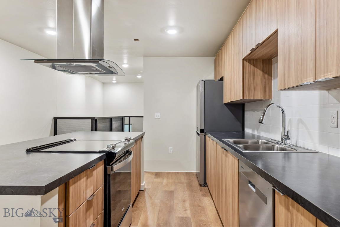 Experience modern living in historic Uptown Butte at Rudolph Condos, Butte's newest condominium development. This 2-bedroom, 2.5-bathroom split-level condo features an open floor plan and a private covered patio for outdoor enjoyment. The stylish kitchen boasts stainless steel appliances, while the spacious living area is perfect for entertaining. Downstairs, two ensuite bedrooms offer comfort and privacy. Located in the heart of Uptown Butte, you’ll enjoy easy access to dining, shopping, and local attractions. Don’t miss this rare opportunity to own a contemporary condo in a vibrant, historic setting! 2 bedrooms are non-conforming