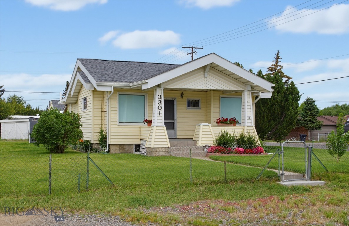 Welcome home to this beautifully updated Craftsman on the Flats in Butte! Blending timeless character with thoughtful modern updates, this inviting home offers a comfortable and functional floor plan with plenty of room to spread out. The main level features a spacious primary suite complete with a private en-suite bathroom, a bright living room with hardwood flooring, an efficient & updated kitchen, a convenient half bath with laundry, and a mudroom for everyday practicality.  The newly finished basement significantly expands the living space with two non-conforming bedrooms, a family room, and a full bathroom—perfect for guests, hobbies, a home office, or additional entertaining space.  Situated on a desirable corner lot with a beautifully landscaped yard, the property offers both covered parking and a detached two-car garage, providing ample room for vehicles, storage, and projects. Major improvements include a new roof and gutters, new furnace, radon mitigation system, added insulation, and a finished basement, giving you peace of mind and move-in-ready convenience.  This is a wonderful opportunity to own a charming Craftsman home with modern updates in a great Butte location!