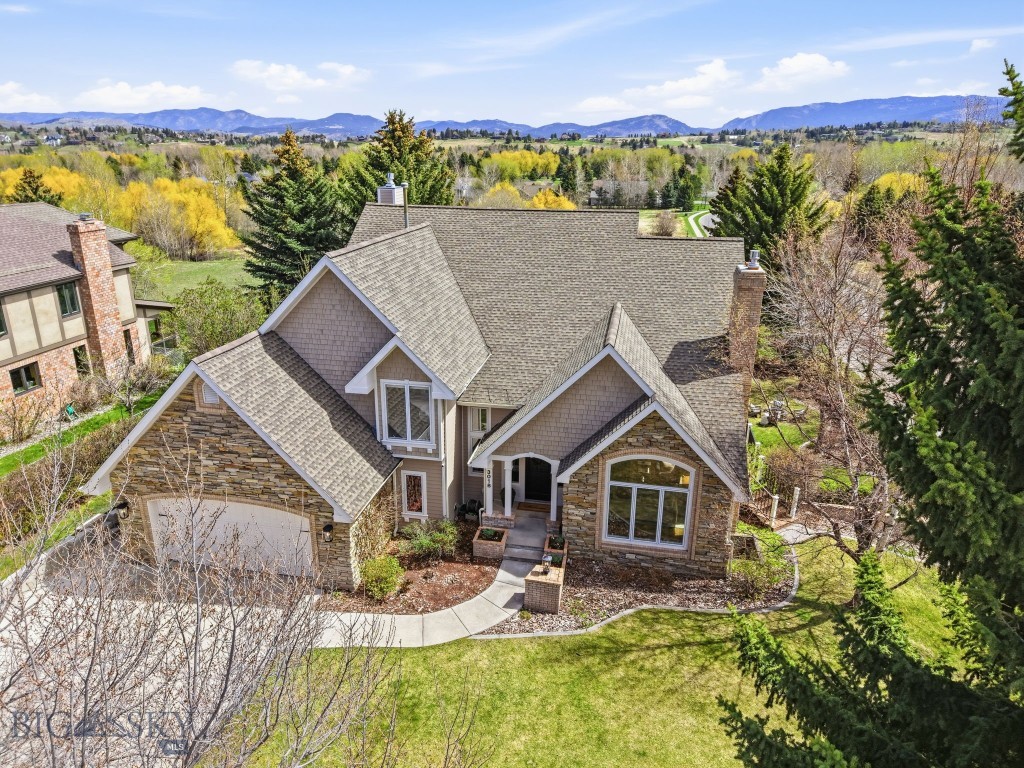 Welcome to 3018 Colter Avenue, an exceptional Southside Bozeman retreat offering space, privacy, and an unmatched connection to the outdoors, all within close proximity to some of Bozeman’s most desirable amenities. Set on an expansive lot just shy of half an acre, this premier hillside property backs to open space and Grafs Park, where meadow, trees, wetlands, and Matthew Bird Creek create a serene and ever-changing natural backdrop. Widely known by locals as the “sledding hill” home, this property offers a rare combination of recreation, privacy, and unforgettable views.

Thoughtfully designed and extensively remodeled, this custom home by Jim Syth showcases quality craftsmanship and timeless finishes throughout. The open-concept main level is anchored by multiple gathering spaces, including a stunning sunroom with massive windows, where panoramic “treehouse” views and breathtaking sunrises take center stage. It’s the perfect place to start the day, with coffee in hand, as wildlife moves quietly through the landscape.

With three fireplaces and both main-level and lower-level living areas, the home offers warmth, flexibility, and room to spread out, whether hosting, relaxing, or simply enjoying everyday life. The full walkout basement features an expansive office and a generous family room ideal for movie nights, game days, and gathering with friends.
Step outside to a private, covered patio complete with a hot tub, hammock, fire pit, and beautifully terraced backyard designed for effortless indoor-outdoor living. The setting invites everything from quiet mornings to lively evenings, all surrounded by mature landscaping, including a “secret garden,” apple trees, lilacs, and peonies that bring color and texture throughout the seasons.

Additional highlights include a brand-new 600± sq ft gym and a spacious dedicated office with French doors, offering flexibility for work, wellness, and creative pursuits.

Ideally located with convenient access to Bozeman’s renowned trail systems, including the Mountains to Main Street network and nearby Sourdough Trail, as well as close proximity to Morningstar Elementary, Sacajawea Middle School, Museum of the Rockies, Montana State University, Bozeman Health, and Main Street, this property offers a rare balance of tranquility and connection.

3018 Colter Avenue is more than a home. It’s a place to grow into, settle into, and enjoy for years to come, surrounded by nature and the very best of Bozeman living.