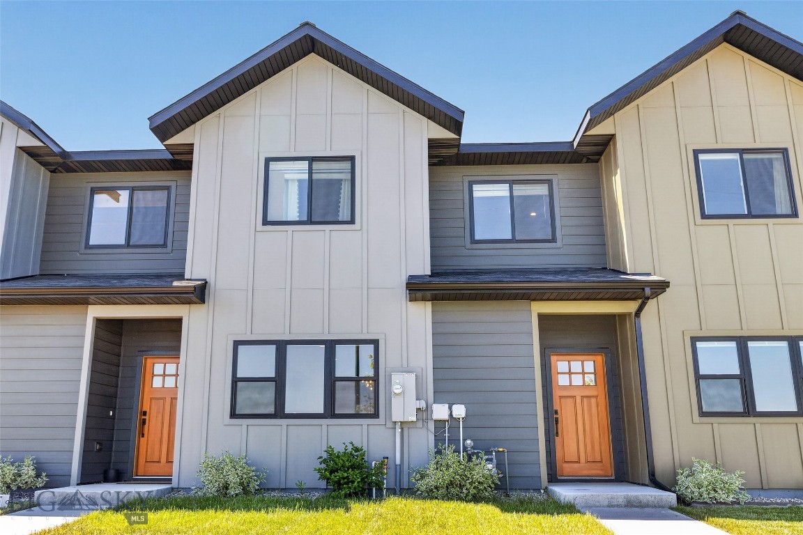 Welcome to the 100 Acre Cottages—where contemporary design, thoughtful craftsmanship, and the natural beauty of Montana come together. Built in 2024 by local builder Blanton Contracting, these exceptional townhomes offer a rare combination of modern comfort and an unbeatable location. Situated directly across from the popular neighborhood dog park, the Gallatin Regional 100 acre park, and surrounded by Bozeman’s renowned outdoor lifestyle. Enjoy unobstructed views of the Bridger Mountain Range and take in spectacular sunsets from your living room window.

Step inside to discover beautifully designed, light-filled interiors with an open-concept layout created for today’s way of living. High-quality finishes are showcased throughout the home, creating a refined yet comfortable atmosphere. The spacious living, dining, and kitchen areas seamlessly blend together, providing the perfect setting for everyday enjoyment and effortless entertaining. The gourmet kitchen features quartz countertops, stainless steel appliances, abundant cabinetry, and sleek modern finishes that elevate the space.

Upstairs, oversized windows capture breathtaking Bridger Mountain views, bringing Montana’s natural beauty into your everyday routine. The generously sized bedrooms offer plush carpeting, ample closet space, and a peaceful retreat at the end of the day.

Beyond your front door, enjoy direct access to walking trails, the Gallatin Regional 100 Acre Park featuring sledding, stocked fishing, cross-country skiing, open green spaces, and the neighborhood dog park—perfect for morning walks, evening strolls, or enjoying the outdoors with your four-legged companions. Centrally located, this home provides convenient access to all the amenities Bozeman has to offer, including nearby Streamline bus transportation for added ease and accessibility.

Experience the perfect blend of contemporary finishes, low-maintenance living, and Montana’s incredible surroundings. The 100 Acre Cottages offer an exceptional opportunity to enjoy modern living in one of Bozeman’s most desirable locations.