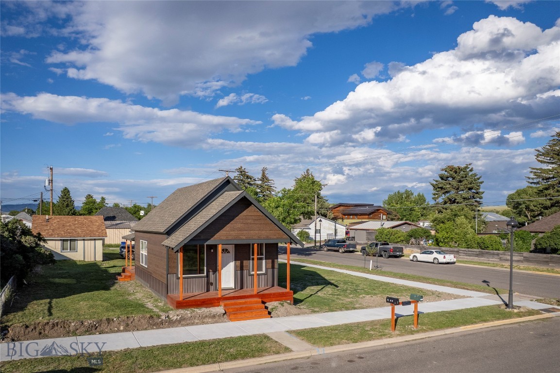 Check out this gorgeous corner home on K and Callender! This 2BR, 1 bath home was completely renovated in 2016, right down to the stud walls and built back out giving you a "like new" home.  Attractive alder cabinets in the kitchen with room for a corner dining table or hutch.  Large picture windows accent the curb appeal and offer maximum natural light. Top floor is dedicated to bedroom #2 with a dormer window looking out to Livingston Peak. Pet/kid/life friendly flooring on the main level, carpet on the steps and upper level for help in noise reduction. Bathroom set up for stack washer/dryer. New siding installed in 2026, metal along bottom and top is sided with LP SmartSide Expert Finish providing advanced durability. New front and back porches and new sidewalks poured, too. Highway Commercial zoning allows for business use and there's ample parking on this corner lot!