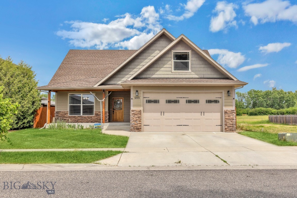 Welcome to 988 Meagher Ave, a warm and versatile 4-bedroom home in Bozeman’s Oak Springs neighborhood. With over 2,200 square feet, there’s plenty of space to spread out, including a bonus room that could be used as a dining room, home office, or cozy den. The vaulted ceiling and gas fireplace with stone surround make the living area feel open and welcoming.

Upstairs, a large bedroom or flex space offers even more possibilities. The backyard is fully fenced with tall privacy fencing for seclusion and security, and it backs to a wide-open green space that adds a peaceful, private feel. A built-in speaker system runs throughout the home and deck for easy entertaining, and there's an attached garage with parking for three more vehicles in the driveway, plus street parking.

Located mere steps from the 0.6-mile Oak Springs Park loop, the home connects directly to the 4-mile Westside Trail, offering seamless access to Bozeman Pond, a local favorite for dog walks, relaxation, and recreation. Part of Bozeman’s extensive 52-mile trail network, this location is ideal for outdoor lovers while staying close to schools, shopping, and everything in between.