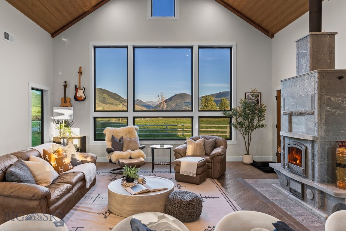 Experience Paradise Valley living from this beautifully custom-built home set on five acres at the end of a cul-de-sac. Thoughtfully designed to capture both privacy and views, this residence offers the rare combination of craftsmanship, accessibility, and location. The dramatic great room is the heart of the home, featuring soaring 20-foot vaulted ceilings, expansive windows, and stunning views that bring the landscape indoors. Solid oak hardwood floors, custom wood accents, and a Tulikivi soapstone fireplace create a warm, inviting Montana atmosphere. The spacious kitchen is designed for gathering and entertaining, with custom cabinetry, quartz countertops, premium appliances, abundant workspace, and an open layout that flows seamlessly into the living and dining areas.

With five bedrooms, three bathrooms, and a dedicated office, the home offers flexibility for family, guests, and remote work. Designed with privacy in mind, the layout features a private primary suite and office wing, while guest and secondary bedrooms are set apart. Thoughtful custom finishes throughout reflect the quality and care behind every aspect of the home’s design and construction.

Outside, the fully fenced property is ideally suited for horse lovers, with horse shelters, automatic horse waterers, and Mill Creek irrigation water rights to help keep the pasture productive. An oversized 30' x 44', 4-car garage with loft space above plus a custom storage shed, provide exceptional storage and flexibility.

Ideally situated near Chico Hot Springs and Sage Lodge, just 20 minutes from Livingston and approximately 45 minutes from Yellowstone National Park, the property offers convenient access to all that makes Paradise Valley so special.