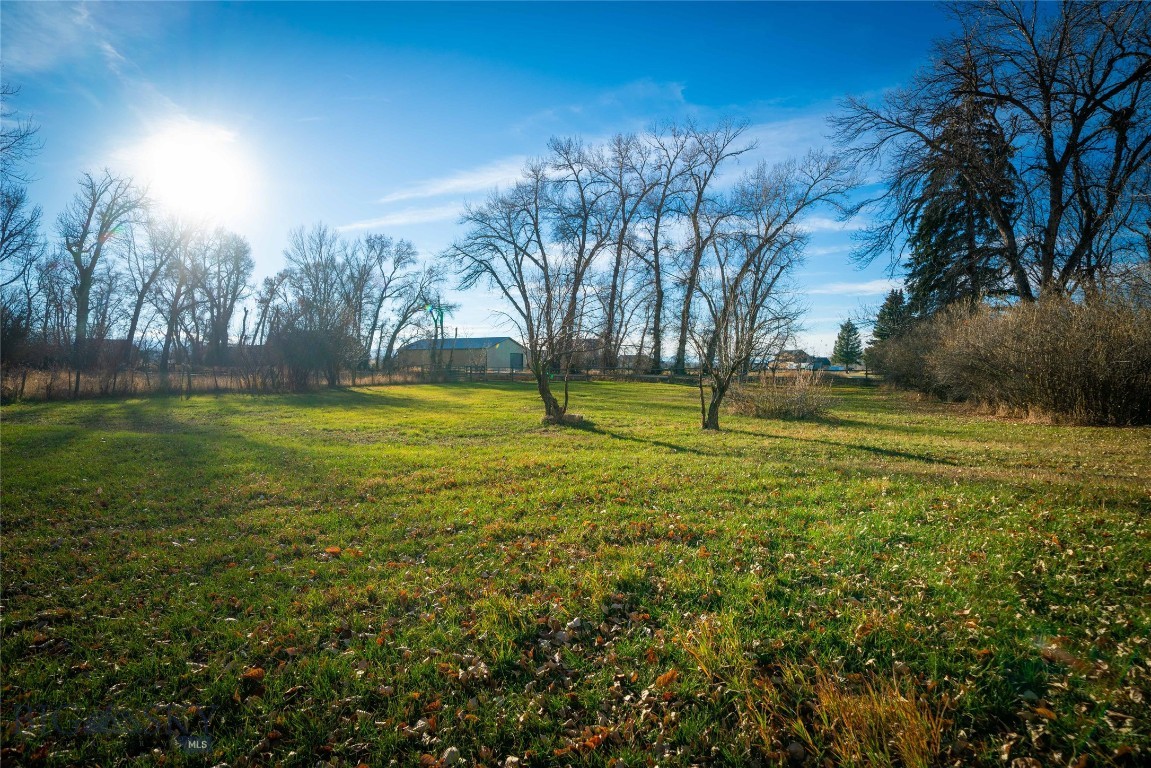 Discover an exceptional 2-acre property at 5044 Monforton School Road, perfectly positioned in the highly desirable Monforton School District. Surrounded by mature trees and a great view shed this rare offering provides both privacy and convenience with easy access to Bozeman, Four Corners and Big Sky corridor amenities.
Zoned RR/A Subdistrict, the property allows for a wide range of uses by right, including single-family homes up to and including four-plexes—a valuable opportunity for future development or investment. Additional conditional uses may be possible with a CUP, offering even greater flexibility.
Older accessory structures, along with a 1925 farmhouse, convey with the property and offer potential for renovation, storage or redevelopment. Whether you’re seeking a homesite, income-producing opportunity or long-term hold, this versatile acreage delivers exceptional potential in a prime location.