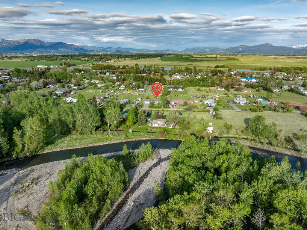 Just south of Four Corners on Magenta Road, this nearly 1-acre property offers a rare opportunity to enjoy Montana living with space, convenience, and the Gallatin River just moments away. Set in one of the valley’s most desirable locations, the property sits less than 9 miles from both Bozeman and Belgrade, while Big Sky Resort is an easy drive south for world-class skiing, golf, hiking, and year-round adventure. Nearby public access to the Gallatin River places blue-ribbon fishing, floating, and recreation close to home without the maintenance of riverfront ownership. The 0.96± acre lot provides the freedom to create your ideal setup — gardens, outdoor entertaining spaces, a fire pit under the stars, additional storage, or simply room to enjoy wide-open Montana skies and privacy. Inside, the single-level ranch-style home features a practical and comfortable 4-bedroom, 2-bath floor plan designed for easy everyday living. No stairs, no wasted space — just a functional layout that fits a variety of lifestyles. This home has so many extras, 2 dedicated living rooms, a 5th (extra) room, and a lush yard that needs to be seen to be appreciated. The attached 2-car garage offers even more versatility with a large shop space in the back, ideal for projects, storage, outdoor gear, hobbies, or a dedicated workspace. The back covered porch is complete with grill, hood and gas line just perfect for entertaining. This is the kind of property that’s increasingly difficult to find in the Gallatin Valley — close to everything, yet with the space and character that make it feel a world apart.