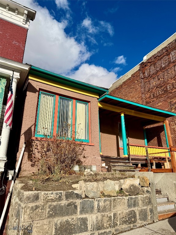 Discover a charming slice of historic Butte in this character-filled 3-bedroom, 1-bath home just moments from Montana Tech’s university campus. With 1,247 sq. ft. of inviting living space, this residence illustrates classic details including timeless hardwood floors, crown molding, built-in drawers and cabinets, and a gorgeous bay window that brings in warm natural light. A cute front deck welcomes morning coffee or evening sunsets, while the oversized single-car garage offers plenty of room for storage, gear, or workshop space. Situated in one of Montana’s most fascinating towns, you’re surrounded by rich heritage, vibrant local culture, and endless recreational opportunities. Mountain views, nearby trail systems, and easy access to the Pintlers, Highlands, and Tobacco Roots make this a great launching point for outdoor enthusiasts. Investment-minded buyers will appreciate its prime location near campus—ideal for renting to students. It’s a cozy place to call home or a wise investment in a growing area!