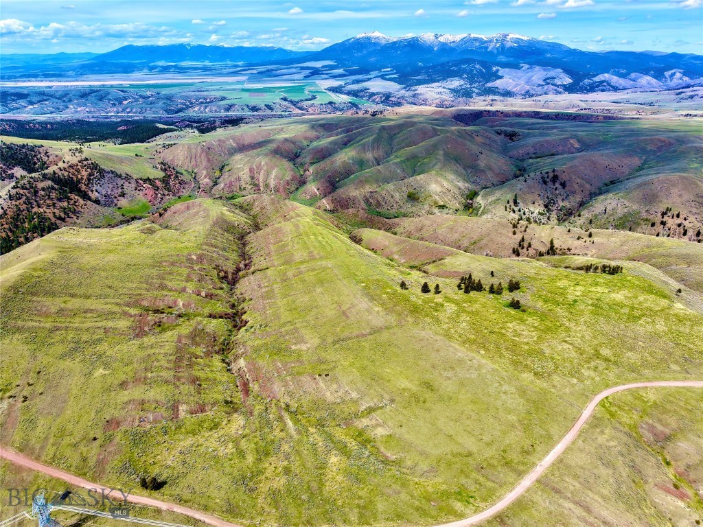 Scenic Serenity on Ridge Road offers 35 deeded acres of rugged Montana beauty just outside Townsend, surrounded by sweeping valley views, rolling hills, and wide-open skies. With no covenants or HOA and legal access via Ridge Road, this property is well-suited for those dreaming of a simple dry cabin, seasonal camp, off-grid retreat, or private recreational basecamp. The land’s elevated setting captures expansive majestic mountain and valley scenery, creating a quiet escape with room to spread out, unplug, and enjoy Montana on your own terms. Located in the heart of Broadwater County’s “Valley of Adventure,” the property is close to some of the area’s best outdoor recreation. Canyon Ferry Lake offers boating, year-round fishing, camping, hiking, swimming, water sports, and wildlife viewing. Nearby Hauser Reservoir and the Missouri River provide even more opportunities for fishing, floating, boating, and camping. The property lies in Hunting District 391, an area known for deer and elk hunting, with surrounding public lands adding to the outdoor appeal. Whether you are looking for a weekend getaway, hunting camp, off-grid hideaway, or a quiet place to build a rustic retreat, this Ridge Road acreage delivers privacy, scenery, and access to the recreational lifestyle Montana is known for—all within a short drive of Townsend and about 35 minutes from Helena.