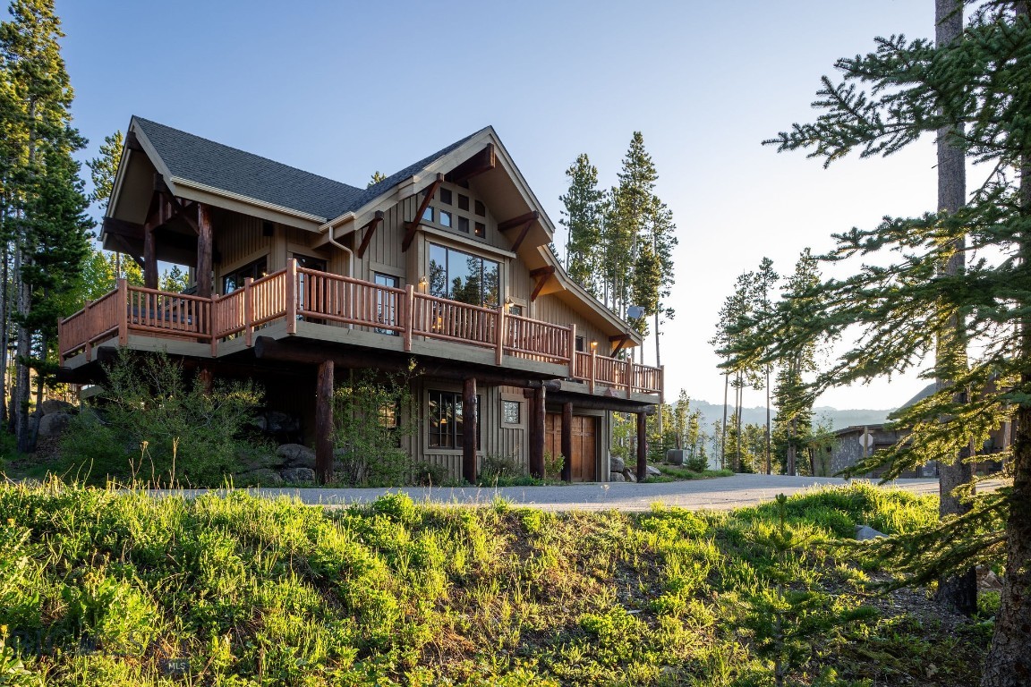 Nestled on a corner lot in Cowboy Heaven, this furnished mountain retreat offers a rare combination of ski access, Lone Peak views, and year-round recreation in the heart of Moonlight Basin. With the ability to ski home and convenient ski access out to both the Madison Base Area and Moonlight Lodge, the property provides an exceptional connection to Big Sky's renowned terrain.

Designed for gathering and relaxation, the main living spaces feature an open layout connecting the kitchen, dining area, and living room, creating a comfortable setting for entertaining after a day outdoors. Multiple fireplaces add warmth and character throughout, while large windows frame views of Lone Peak and the surrounding mountain landscape. With bedrooms thoughtfully distributed across three levels, each with its own ensuite bathroom, the layout offers privacy and flexibility for family and guests alike.

The wraparound deck with hot tub extends the living space outdoors, offering inviting spaces to enjoy morning coffee, summer evenings, or après-ski gatherings. Positioned on a desirable corner lot, the home balances privacy with easy access to the amenities and recreation that make Moonlight Basin one of Big Sky's most sought-after communities.

Optional Moonlight Basin membership provides access to the Moonlight Lodge, Lake Lodge, private trails, dining, fitness facilities, and recreation at Ulery's Lake, including paddleboarding, kayaking, fishing, and swimming. Miles of hiking and biking trails are also nearby, creating endless opportunities to enjoy the outdoors throughout the year.

Whether your ideal day includes first tracks in winter, an afternoon at the lake, or exploring the trail network in summer, this inviting mountain home offers an exceptional opportunity to experience the best of Moonlight Basin living.