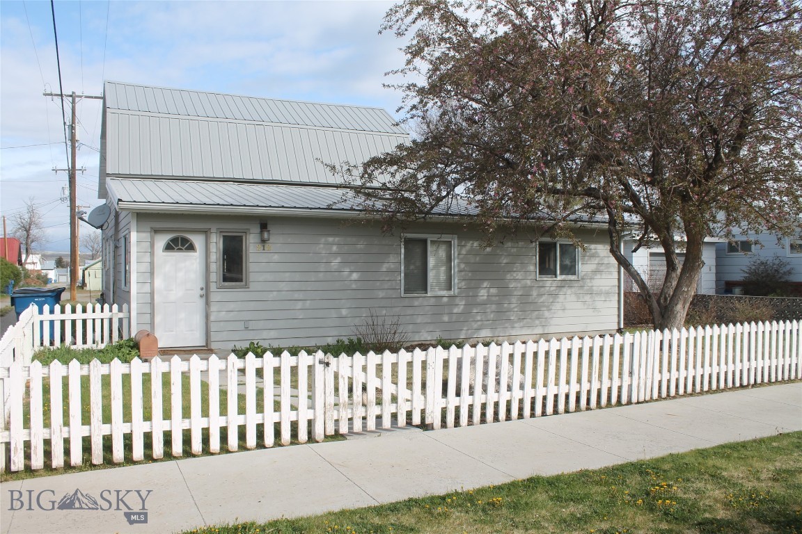 This charming 2,000sq/ft three bedroom and two bath home is conveniently located in the heart of downtown Big Timber. The home features fresh interior paint and updated flooring, providing peace of mind and a touch of modern comfort. This home offers a spacious layout perfect for family, guests, or a home office. The main level includes two bedrooms, a bathroom with tiled walls and a jetted tub, an office or storage room, a laundry room, a living area, and a dining space. Upstairs, you’ll find a roomy master bedroom and a cozy sitting area. The master bath features a ceramic tile floor and a tiled shower with a custom glass door.  With its flexible layout, ample storage, and prime location, this home offers comfort, space, and convenience for a variety of lifestyles. Outside, there’s a handy storage shed, a fully fenced front yard perfect for pets, an underground sprinkler system, and a lovely shade tree. Conveniently close to local shops, dining, and amenities, this move-in ready home blends small-town charm with thoughtful upgrades. Don’t miss the chance to make it yours.