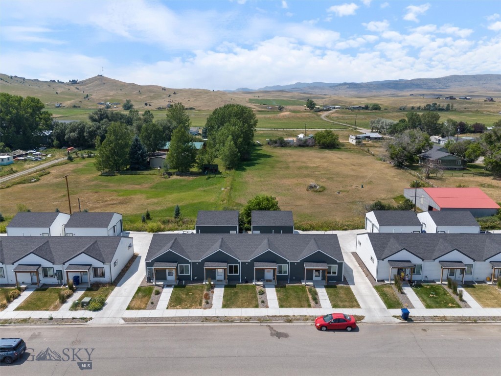 ** $5,000.00 BUYER CREDIT ** This is 407 Brookline St #D—a bright, modern, single-level 2 bed / 1 bath, end unit condo (680 sq ft) built in 2021, designed for simple Montana living with less to maintain and more time to enjoy the outdoors. The layout is open and functional with vaulted ceilings and great natural light, plus a clean, contemporary kitchen setup and comfortable bedroom separation for everyday living, guests, or a home office. Best part for buyers in today’s market: the sellers are offering a $5,000 credit toward buyer pre-paids and closing costs with an acceptable offer (credit amount and terms at seller’s discretion). Highlights: In-unit washer & dryer for true convenience. Private exterior entry + quiet feel. Detached 1-car garage (perfect for bikes, skis, fly gear, and winter storage). HOA covers key items like snow removal, trash, water/sewer, and exterior/structural maintenance. Outside your door: you’re in Livingston—an iconic Yellowstone River town known for its historic downtown, arts scene, and instant access to Paradise Valley. Livingston is also the classic gateway to Yellowstone National Park (about 55 miles to the North Entrance area). And when travel calls, you’re positioned for easy access to Bozeman Yellowstone International Airport. Whether you want a primary residence, a lock-and-leave basecamp, or a clean, low-maintenance investment option, 407 #D delivers the “Montana lifestyle” without the maintenance load.