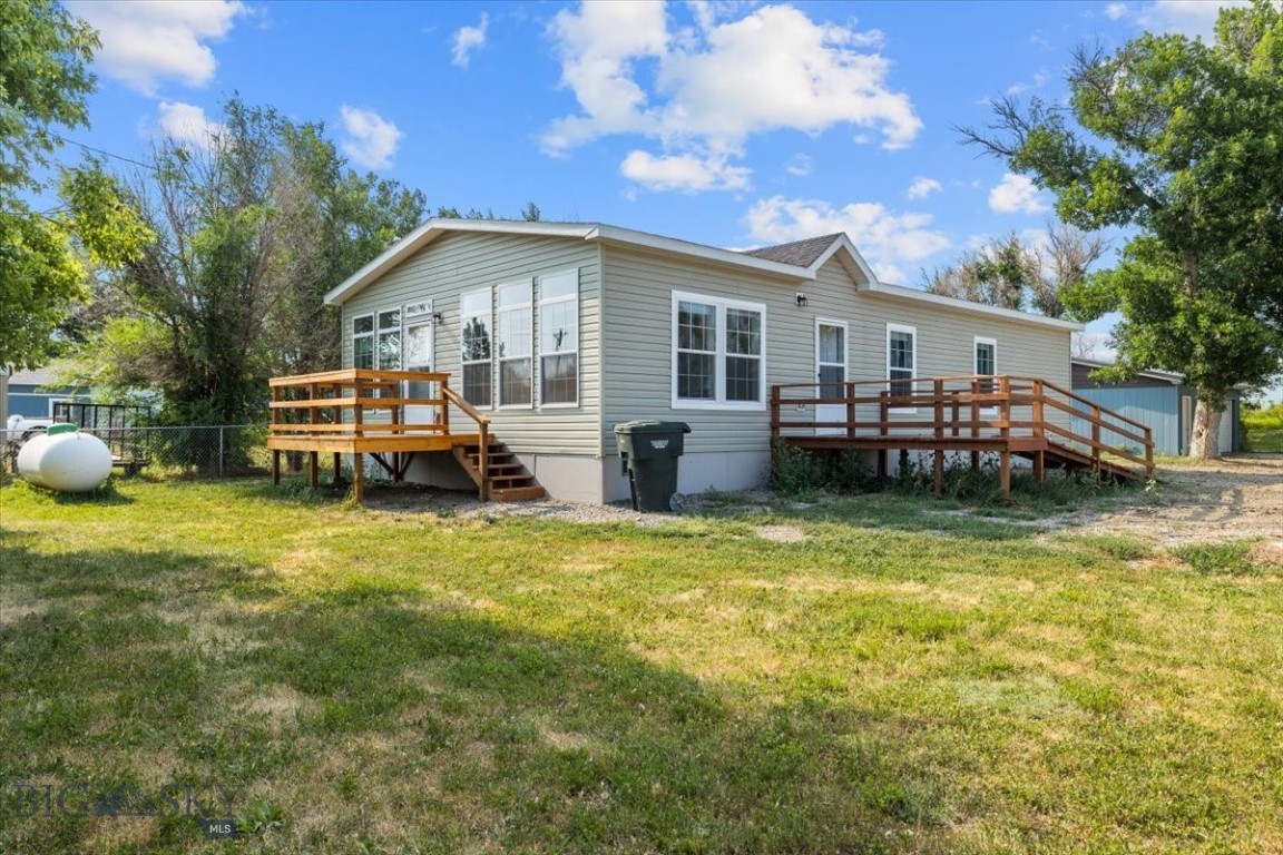 The seller chose this home for its blend of small-town charm, peaceful farmland surroundings, and convenient access to Billings. They love the open, light-filled spaces, thoughtful design, and the comfort it provides for everyday living and entertaining. Built in 2023 with a handicap-accessible ramp, this three-bedroom, two-bath home features a welcoming front porch, vaulted ceilings, and a carpeted living room ideal for relaxing or movie nights. The kitchen offers a large island and luxury vinyl flooring, while the master suite includes a full bath, walk-in closet, and recessed lighting. Enjoy stargazing from the deck, new gutters, and proximity to outdoor recreation and local dining. New survey includes garage and additional lot square footage. Info deemed reliable but not guaranteed. Buyer/buyer agent to verify.