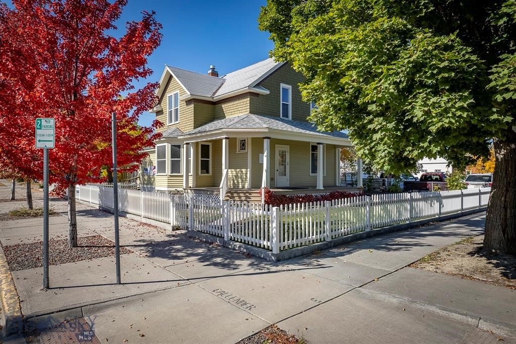 Discover a rare opportunity to own a beautifully preserved and updated 1908 Victorian in one of Livingston’s most sought-after locations—directly across from City/County offices. Rich in character and charm, this distinctive property offers the warmth of a classic home paired with exceptional flexibility for future use. Currently configured as a professional office, the layout easily lends itself to conversion back to a spacious residence, with generous rooms, abundant natural light, and timeless architectural details throughout. A detached 440 sq. ft. building provides the perfect space for a home office, studio, guest quarters, or rental opportunity. For buyers seeking additional income or a live/work lifestyle, the property offers strong commercial potential in a high-visibility location. The property includes six private, on-site parking spaces—an uncommon convenience for a home of this era and location. Whether you envision a charming residence, a home-based business, or a hybrid investment, this unique property delivers character, location, and versatility in one exceptional package. Also listed as a residential property for sale MLS#413165