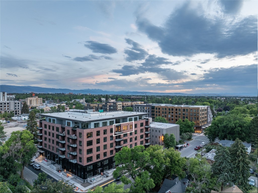 Experience elevated living in this exceptional 2-bedroom + Den, 3-bath residence at The Henry—Bozeman’s premier new downtown address. Spanning 1,635 square feet just one floor below the penthouse, this meticulously upgraded unit offers sweeping Bridger Mountain views and an unmatched level of sophistication.

Nearly every available upgrade has been selected, enhancing the open-concept design with premium finishes and refined details throughout. Large windows flood the space with natural light, while the expansive layout includes a versatile den—perfect for a home office or guest space.

Enjoy rare downtown amenities including underground climate-controlled parking, private storage, a fitness center, and bike room, and private courtyard with a grill and fire pit—all just 3 blocks from Main Street. One of the final upper-level units remaining, this is a rare opportunity to own in the only luxury project of its kind expected in the next several years.
