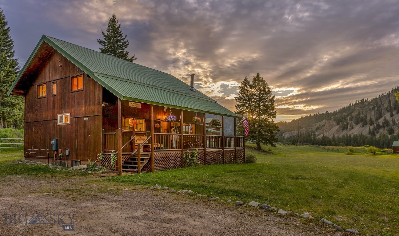 Experience the timeless charm of Upper Rock Creek Valley, with live water and breathtaking views abound. This area, once the staging ground for the original Rock Creek outfitters, offers an unmatched blend of historic Montana character and natural beauty. With expansive hunting and fishing grounds nearby, and the Blue Ribbon Rock Creek flowing through the heart of the valley, this property exemplifies the enduring allure of large ranches and national forest lands. This property features a meticulously remodeled 5 bedroom, 3 bath home set on nearly 2 irrigated acres, with water rights to Stoney Creek. The residence showcases Western craftsman details, including hardwood floors, open beams, and knotty pine tongue-and-groove accents, complemented by newly installed mini-splits for modern comfort. Previously a successful short-term vacation rental, the property offers ample space in a picturesque setting.