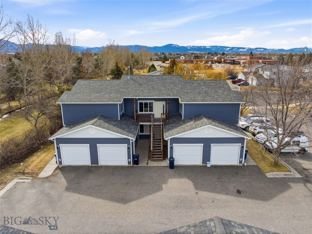 Prime Bozeman fourplex investment opportunity in a highly desirable central location. This well-maintained property features two 3-bedroom, 1.5-bath units and two 2-bedroom, 1-bath units, each with a one-car garage and private patios that back to mature landscaping, green space, and a seasonal creek. Recent improvements include new siding, updated flooring, and in-unit washers and dryers. All four units are currently leased. Ideally situated adjacent to a single-family residential neighborhood and near Emily Dickinson Elementary, the property is also close to parks and conveniently located near the Oak Street and 19th Avenue commercial corridor. Professionally managed with consistent maintenance for over two decades, this property represents a rare turn-key multifamily opportunity in the Bozeman market.