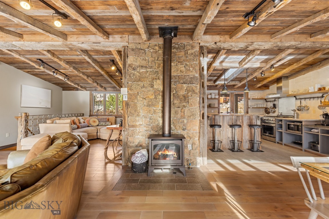 The home itself is an experience—and its extraordinary location delivers front-row seats to one of America’s most protected landscapes, Yellowstone National Park. Artist-designed and renovated with intention, this property's high-end materials and design elements have been carefully curated and collected over time, creating a sense of place that is both refined and unmistakably rooted in the American West.
Perched above the Yellowstone River on 0.33 acres, this 3,700-square-foot, 5 bedroom/5 bathroom retreat lives like a private lodge. On the main level, an authentic stacked stone surround with gas burning stove sets the tone, complemented by three ensuite bedrooms, a window-lined dining area, two inviting living spaces and covered back porch to watch the deer and antelope play.    And at the heart of it all, the high-styled kitchen—rich with old-world charm and elevated finishes—is equal parts functional and unforgettable.

Downstairs, the sun-filled lower level offers two additional ensuite bedrooms, a full laundry room, a standout bar that could easily serve as a kitchenette and a large game room designed for all ages. Step outside and gather around the fire pit to watch wildlife like never before—Bald eagles diving for trout, cow elk moving through the valley with their newborns, bison swimming across the river and antelope playing across the open fields. Currently performing as a high-end vacation rental yet equally suited for year-round living, the home offers exceptional versatility. The layout also presents potential for an upper/lower duplex-style configuration—ideal for multi-generational living or a private owner’s level with separate guest quarters.

A legacy property like this doesn’t come along often—an iconic foothold in the American West, with Yellowstone National Park as your backdrop. *Financials available upon request