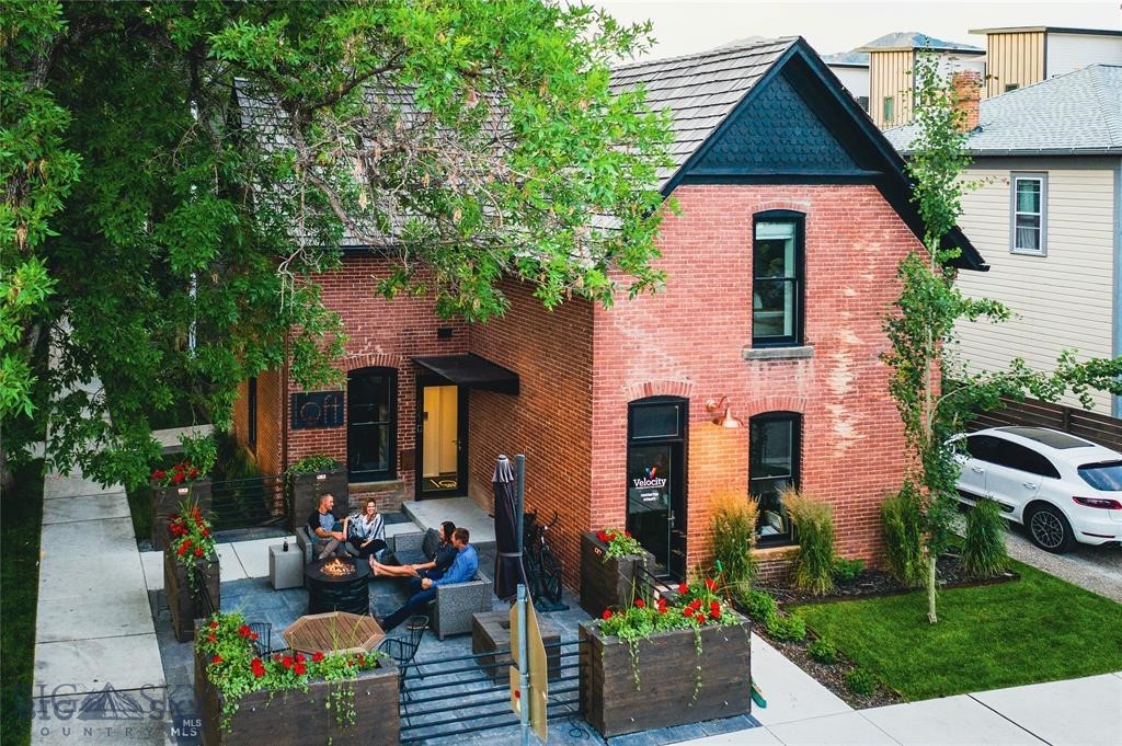 102 North Church Avenue is one of Downtown Bozeman's most recognized and storied addresses. Originally built in 1889 and comprehensively renovated in 2017, this landmark mixed-use building blends historic character with refined modern design, earning a Historic Preservation Award in 2018. Located within the city's premier B-3 commercial zoning district, the property delivers approximately $175,000 in gross annual income across two fully operational units.
The main level features a beautifully appointed executive office suite with four private offices, a conference room, coffee bar, efficiency kitchen, and restroom. Upstairs, Loft503 is a fully furnished two-bedroom luxury residence with a proven track record as a successful vacation rental and multiple pathways for continued use. Three private entrances offer exceptional flexibility, while outdoor spaces including patios, a fire pit, and curated landscaping round out the experience.
Whether you are an owner-user, institutional investor, or development-oriented buyer, this property offers a rare combination of income, flexibility, and irreplaceable downtown Bozeman character. Contact the listing agent for additional details on this one of a kind property.