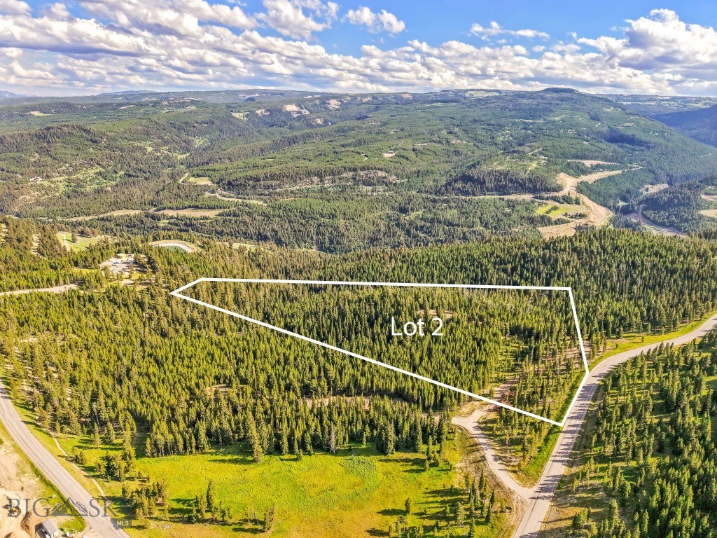 Welcome to Lot 2, Wheatgrass Meadows — 9.59 Acres of Elevated Possibility
Set on a ridge within the newest developer release in Spanish Peaks Mountain Club, Lot 2 in Wheatgrass Meadows offers an expansive 9.59-acre homesite with stunning natural surroundings and incredible potential. Framed by mature trees and neighboring open space, this parcel delivers the peace, privacy, and mountain views that define Big Sky living. The site has already been improved with initial landscaping and a roughed-in driveway, allowing you to easily walk the land and envision your future build. Take a moment at one of the scenic picnic spots placed throughout the property—perfect for soaking in the fresh mountain air and the dramatic alpine vistas that stretch in every direction. What sets Lot 2 apart is not just its size, but its flexibility. With ample room to accommodate a spacious primary residence and a separate guest home, this property invites you to think big. Whether you’re crafting a private retreat or a legacy estate to be enjoyed for generations, Lot 2 is the perfect starting point. You can bring your own architect and builder or choose to work through the Spanish Peaks Design Build Program to simplify the process from concept to completion. Ownership offers opportunity for either a Signature Golf or Social Membership at Spanish Peaks Mountain Club upon approval, giving you exclusive entry to private amenities including Tom’s 10 Par 3 Golf Course, the new Aspire Lodge, miles of trails, and year-round recreation. Just down the road, the Montage Big Sky offers five-star experiences with luxury spa services, dining, and ski access to Big Sky Resort. With only two lots available in this private enclave, Lot 2 at Wheatgrass Meadows stands as a rare opportunity to build something truly exceptional in the heart of Big Sky.