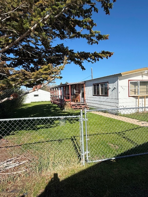 If you need a getaway or a permanant residence this is it! The 1976 single wide mobile home is on a mature, fenced lot with trees, shrubs and flowers. Amenities include a 2 car garage, new flooring in the mobile and a new water heater. The home is being sold furnished. The mobile is a 1976 s/n 9753.