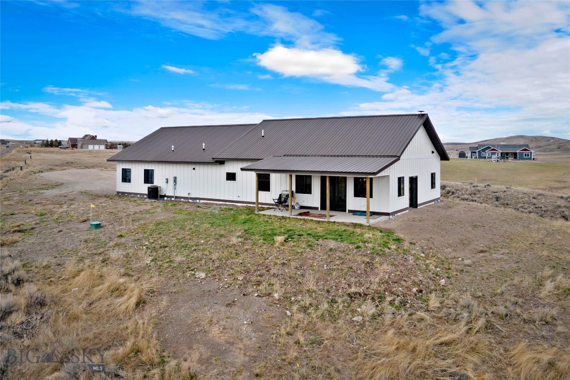This 3-bedroom, 2-bathroom home delivers 1,800 square feet of well-crafted living space in a setting that captures Montana's wide-open landscape. Built with quality materials and careful attention to detail, this property stands out for its combination of solid construction, generous land, and a location that balances rural tranquility with everyday convenience.

Step inside and you'll notice the character right away. Barn wood doors add rustic appeal throughout the home, while a wood-paneled ceiling brings natural warmth to the living spaces. Abundant windows fill the rooms with natural light, creating a bright and welcoming feel. The master suite features its own private bathroom, offering a comfortable personal place to get ready for the day ahead. A 2-car garage provides ample room for vehicles, gear, and weekend projects.
The generous 5 acre lot provides sweeping views and ample room for outdoor living, gardening, or simply soaking in the tranquil surroundings. Equestrian enthusiasts will appreciate that two horses are permitted, making this an ideal setting for those who dream of a countryside lifestyle with room to roam.

Nestled right outside the charming town of Three Forks, residents enjoy close proximity to Three Forks schools, convenient access to Belgrade, and a manageable drive to Bozeman Yellowstone International Airport for travel needs. The vibrant culture and amenities of Bozeman are also within easy reach.
Schedule your private showing today.