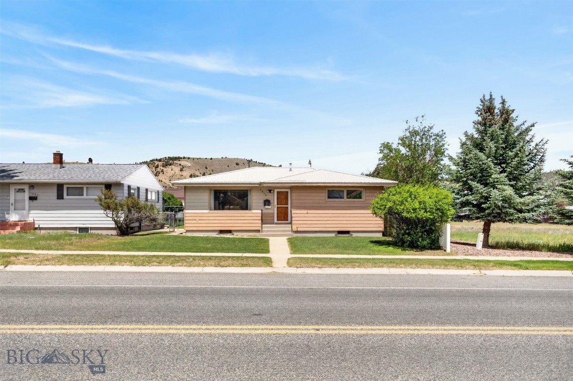 This well-maintained home shines like a gem and offers comfortable living space both inside and out. The main level features 2 bedrooms, 1 bathroom, a welcoming living room, a spacious family room with a cozy fireplace, and a functional kitchen designed for everyday living.
The finished basement provides additional versatility with a second living area, an additional bathroom, a bonus non-conforming bedroom perfect for an office, hobby space, or guest accommodations, and a convenient laundry area.
Durable metal siding and a metal roof, both in excellent condition, add lasting value and curb appeal. Outside, you'll find a fenced backyard complete with a storage shed and an oversized detached two-car garage featuring an additional carport and convenient alley access.
Situated on a beautifully landscaped lot in desirable west Anaconda, this property offers a wonderful combination of comfort, functionality, and pride of ownership. Whether you're looking for extra living space, ample storage, or a move-in-ready home, this property is ready to welcome its next owner.