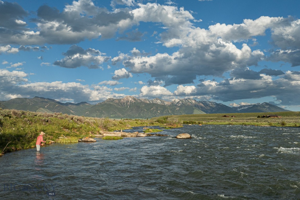 Available for the first time in nearly 40 years. Set along one of the upper Madison River's most scenic stretches, Madison River Ranch spans 228± acres with a half mile of private river frontage and a spring creek that originates on the property. The terrain is strikingly varied. From the river and spring creek, the property rises over 100 feet to elevated benches with panoramic views of the surrounding mountains. The higher elevations offer scale and unobstructed vistas, while the lower reaches form a rare, protected riparian oasis in a landscape more often defined by wide-open grasslands. The property sits within a documented elk migration corridor and supports abundant wildlife throughout the seasons. While much of the surrounding viewshed is protected by conservation easements or public lands, Madison River Ranch remains unencumbered, offering flexibility for the next owner while standing as a clear conservation candidate given its ecological significance.