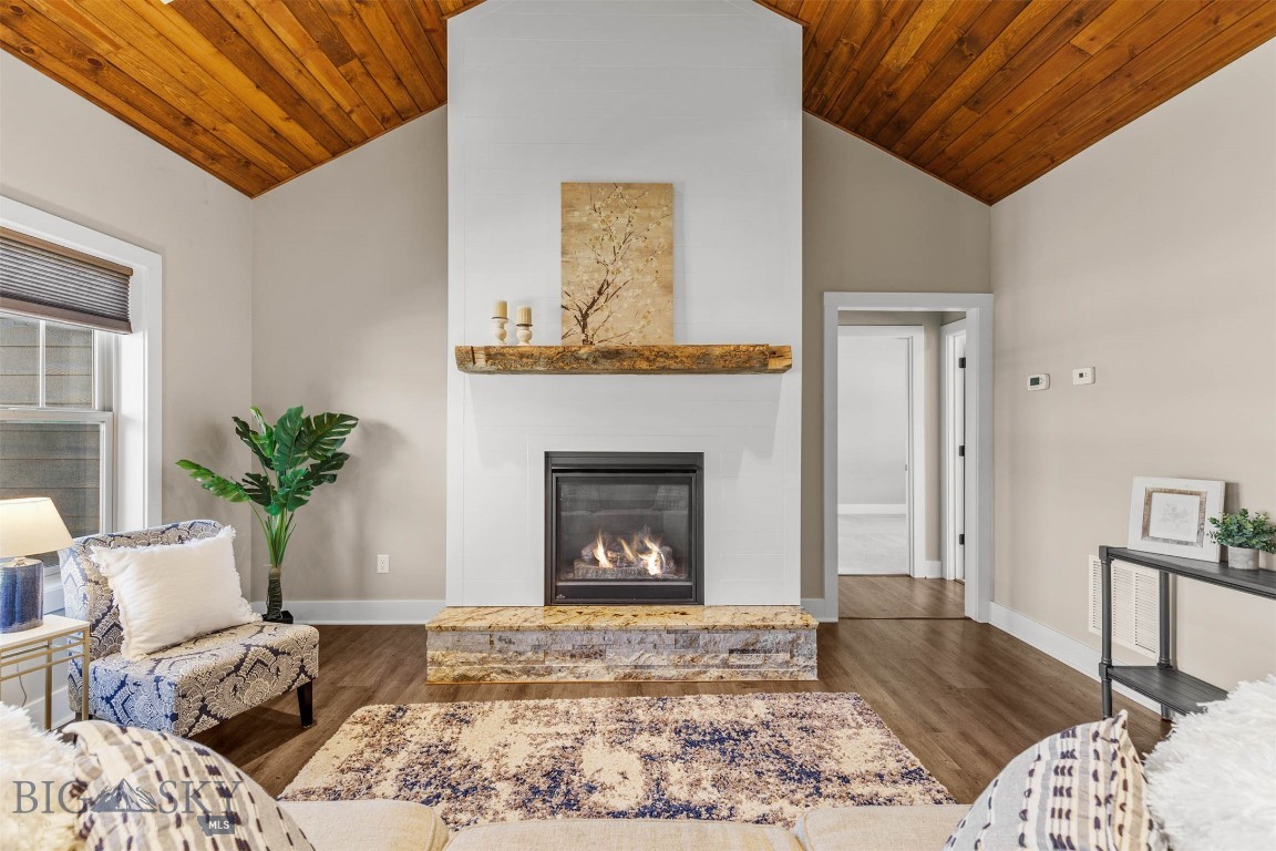 Welcome to your Montana dream home—where refined design, thoughtful details, and everyday comfort come together seamlessly. This beautifully crafted, single-level residence offers the ease of main-floor living, highlighted by a rare fourth bedroom—perfect for guests, a private office, a second living area or play space.

Designed with both privacy and functionality in mind, the smart split floor plan places the spacious primary suite apart from the additional bedrooms, creating a peaceful sanctuary within the home. Step into the heart of the home and you’ll immediately appreciate the inviting open-concept living area, where rustic wood ceiling paneling and a cozy gas fireplace with a custom reclaimed wood mantle add warmth, charm, and a touch of Montana character.

The living space flows effortlessly into the dining area and well-appointed kitchen—ideal for entertaining or simply enjoying quiet nights in. A generous walk-in pantry and ample counter space make both cooking and storage a breeze.

The primary suite is a true retreat, featuring dual vanities, a luxurious soaking tub, a separate walk-in shower, and not one—but two—walk-in closets. The guest bathroom also offers dual vanities, providing added convenience and comfort for family and visitors alike.

Stay cool through Montana’s sunny summers with central air conditioning, and enjoy outdoor living in the fully fenced backyard—perfect for relaxing, playing, or hosting gatherings. The covered back patio invites year-round grilling and unwinding, while the front porch offers stunning mountain views—an ideal setting for morning coffee or evening sunsets.

Nestled on a quiet street, this home delivers a sense of peaceful retreat while remaining just minutes from the charm, recreation, and amenities that make Livingston such a beloved place to call home.