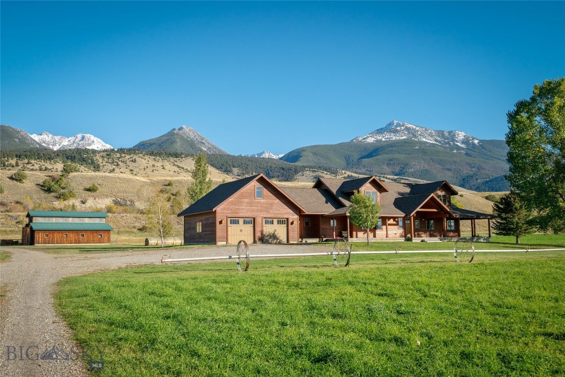 BRING YOUR HORSES to the perfect Lifestyle Ranch in the heart of Paradise Valley.  44.16 lush acres with first water rights from Strawberry Creek that irrigate a productive 35-acre hay field yielding up to 5 tons per acre - All wheel lines and irrigation equipment conveys with the property. The CUSTOM DESIGNED 3-bedroom, 2.5-bath residence offers a rare blend of comfort, craftsmanship, and breathtaking scenery. In winter, gather around the wood-burning fireplace and take in the sweeping views of the Absaroka Mountains, perfectly framed by the living room’s expansive wall of windows. The thoughtfully designed main level features a spacious primary suite, formal dining room, inviting living area, well-appointed kitchen, and laundry room. Upstairs, you'll find two additional bedrooms, a full bath, and a loft, bringing the finished living space to approximately 3,500 square feet. A 1,772-square-foot unfinished basement and a bonus room above the garage offer ample potential for future expansion. Outside, the property is equally impressive. A 28' x 40' workshop with a 12' x 26' lean-to and a 35' x 45' post-and-beam barn provide versatile space for livestock, hay and equipment storage, or hobbies. Wildlife lovers will appreciate the seasonal visits from elk herds with as many as 300 elk. And when summer arrives, the wrap-around covered porch becomes the perfect retreat—offering shade, serenity, and a front-row seat to Montana’s natural beauty. LOCATION is less than 30 minutes to Livingston, 40 minutes to Yellowstone National Park, and 10 minutes to Chico Hot Springs Resort, Sage Lodge, Yellowstone River fishing access, and all the amenities of Emigrant, MT.  TONS OF WATER, SPECTACULAR VIEWS, FANTASTIC LOCATION - call for your appointment today!
