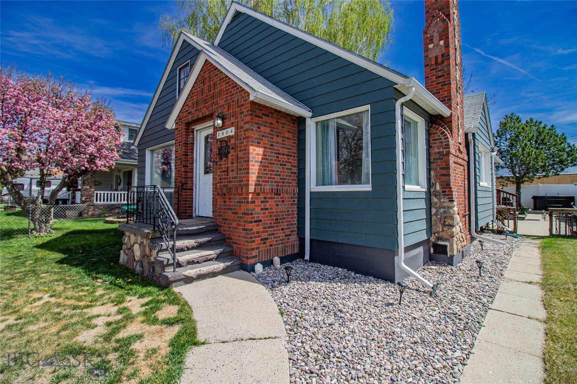 Charming and full of potential, this beautifully maintained 3-bedroom, 2-bath home sits in a desirable neighborhood on the flats surrounded by trees and great curb appeal. On the main floor you’ll find a warm and inviting layout with 3 bedrooms, 1 bathroom and plenty of space to spread out. The fully finished basement features a cozy living area, bar space perfect for entertaining, a full bathroom, and laundry room. The upstairs offers additional unfinished space ready to become whatever fits your needs, an extra bedroom, office, playroom, or bonus living area.
Step outside and enjoy the private backyard complete with a spacious patio, deck, and a hot tub, perfect for enjoying Montana evenings. A double-car garage adds convenience and extra storage. This home offers charm, functionality, and room to grow.