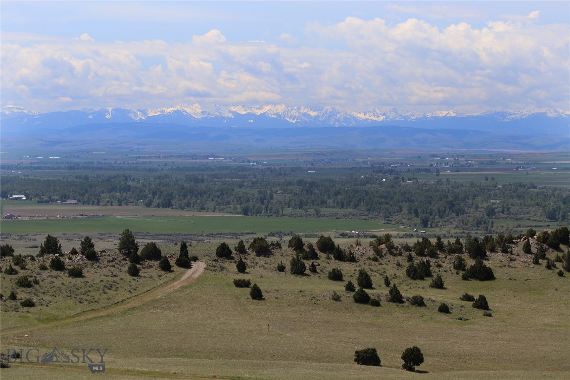 This exceptional 20+ acre parcel in the Gallatin River Ranch offers a rare opportunity to build your Montana dream home without delay! The well is already installed, power has been brought in, and septic approval is in place for a three-bedroom home— complete with plans that could pass on to a new owner, saving you valuable time, energy, and upfront costs. 

Perfectly sited to capture panoramic views of the Bridger Mountains, Absarokas, Spanish Peaks, and Tobacco Roots, the lot features a sunny southern exposure and gently rolling topography ideal for a stunning homesite, and is adjacent to two large private ranch holdings for added privacy. This property offers the perfect blend of natural beauty, privacy, and community. Watch elk, antelope and deer roam through open meadows, ride horses along miles of scenic trails, or cast a fly into blue-ribbon trout waters—this is the Montana lifestyle at its best.

Located just 10 minutes from Manhattan and 25 minutes from Bozeman, you’ll enjoy convenient access to small-town charm and big-city amenities alike. Ownership at Gallatin River Ranch also includes exclusive access to two private East Gallatin River fishing areas, over 1,600 acres of common space for hiking and horseback riding, and an easy commute to the world-class equestrian center centrally located in the GRR (privately owned and operated).

Don’t miss your chance to own one of the most build-ready parcels in the Ranch, with million-dollar views and unmatched amenities already in place.