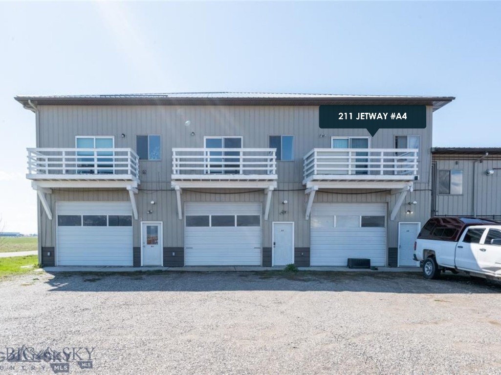 Welcome to this exceptional commercial condo that perfectly blends comfort and functionality, nestled amidst stunning views of the Bridger Mountains. This unique property boasts an impressive 39' x 14' shop, ideally suited for a variety of commercial uses, making it a rare find in today's market. Step inside and discover the thoughtfully designed office space located on the upper level, offering a productive work environment that takes advantage of natural light and captivating mountain views. The east-facing deck provides a serene spot to enjoy your morning coffee, all while soaking in the beauty of the landscape. This property is a dream for hobbyists and enthusiasts alike, with ample storage for vehicles, trailers, campers, and all your favorite work items. The 12' x 10" garage door ensures easy access, allowing you to conveniently store your belongings without any hassle. With its prime location near the airport, you’ll appreciate the ease of travel and close proximity to amenities, all while enjoying the peaceful ambiance of the surrounding area. This condo is an excellent opportunity for those seeking a versatile space that accommodates both personal and professional pursuits. Don’t miss your chance to own this remarkable property. Schedule your showing today and envision the possibilities that await in this extraordinary space.