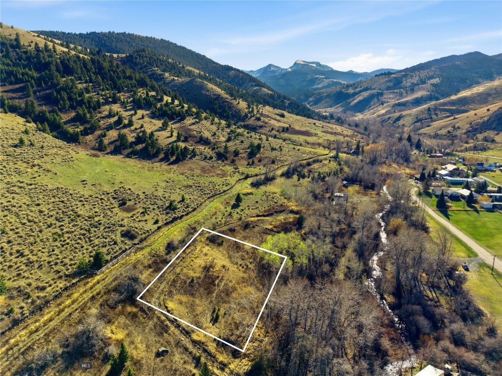 Own a piece of Pony’s past with this .275-acre offering on the original 1877 townsite plat. Three contiguous, never-developed lots rest near Willow Creek, tucked in a wooded, private setting with the soothing sound of water and rugged Tobacco Root views. It feels like a retreat yet remains walkable to the iconic Pony Bar and the heart of this storied 1860s mining town.

A versatile canvas for your vision—cabin getaway, seasonal escape, or long-term hold—this parcel blends small-town charm with easy access to recreation. Explore nearby trails, fishing, and public lands, then return to the tranquility of your own timbered nook under Montana skies.

Highlights:

0.275 acres (three original 1877-platted lots)
Wooded privacy near Willow Creek with mountain ambiance
Short stroll to the Pony Bar and historic main street
Quiet setting close to abundant outdoor recreation