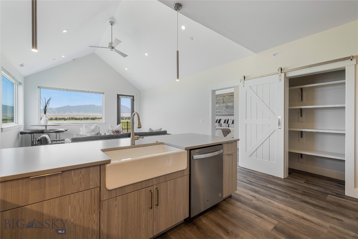 Set against the wide-open landscapes and river corridors that define the Madison Valley, The Drift at North Forty offers a rare opportunity to own new construction in the heart of Ennis. Located within walking distance of Main Street and minutes from the Madison River, these 3-bedroom, 2-bathroom residences provide immediate access to both town and open country. Each home is designed for low-maintenance living with an open-concept layout and expansive windows that frame mountain views and fill the space with natural light. Finishes are durable and clean, designed with a timeless aesthetic that complements the surrounding landscape. The interiors balance practicality and comfort, making the home equally suited for everyday living and extended stays. The walkout primary suite offers privacy and direct outdoor access, while two additional bedrooms allow flexibility for guests, family, or a home office. An attached one-car garage and a dedicated storage unit provide ample space for fly rods, skis, and other gear that comes with living in the Madison Valley. Upper-level residences benefit from elevated sightlines and broader valley views. Short-term rentals are permitted, offering owners the option to enjoy the property personally while maintaining income flexibility. World-class fly fishing on the Madison River, hunting and hiking on nearby public lands, and skiing at Big Sky Resort are all within easy reach. Yellowstone National Park and Bozeman Yellowstone International Airport are approximately an hour away, making The Drift at North Forty a well-positioned base for year-round use in the Madison Valley. *This unit is offered fully furnished*