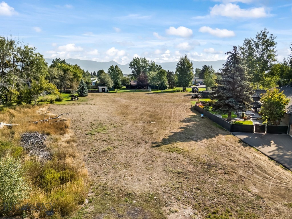 Don’t miss this rare opportunity to own the final undeveloped lot in a peaceful southwest Belgrade subdivision. Nestled among mature trees and backing to expansive open space, this property offers a private, park-like setting with plenty of room to create your dream home. Enjoy the tranquility of an established neighborhood while still being just minutes from Belgrade schools, parks, and downtown amenities. With utilities nearby and a beautiful natural backdrop, this lot is ready for your vision.