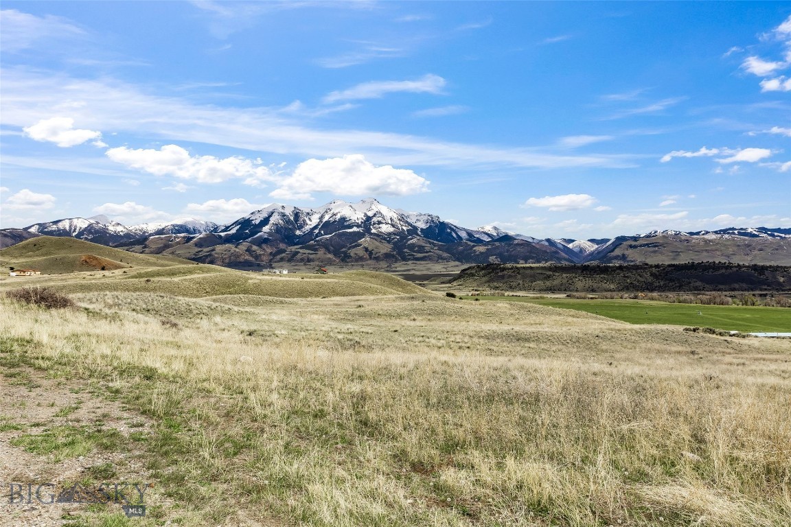 Perched above the Yellowstone River corridor, Lot 24-A is an 8.271 acre parcel offering one of the most coveted positions in Paradise Valley — elevated enough to command sweeping panoramas of the Absaroka-Beartooth Wilderness, while offering year-round livability.
The lot's elevated topography frames a view of some of Montana's most dramatic peaks. The location near Emigrant puts you at the doorstep of the famed Yellowstone River, a blue-ribbon fishery celebrated among anglers. Recreation extends in every direction — hiking, rafting, wildlife watching, and world-class skiing are all within easy reach.
When it's time to unwind, the surroundings deliver. Chico Hot Springs Resort and Sage Lodge, two of Montana's most beloved destinations, are just minutes away, offering natural hot spring pools and renowned dining options that draw visitors from across the country. 
Whether you're envisioning a custom home to live in year-round or a private Montana getaway to escape to on your own terms, this parcel offers the rare combination of untamed scenery, practical access, and genuine community character that defines the best of Paradise Valley living.
