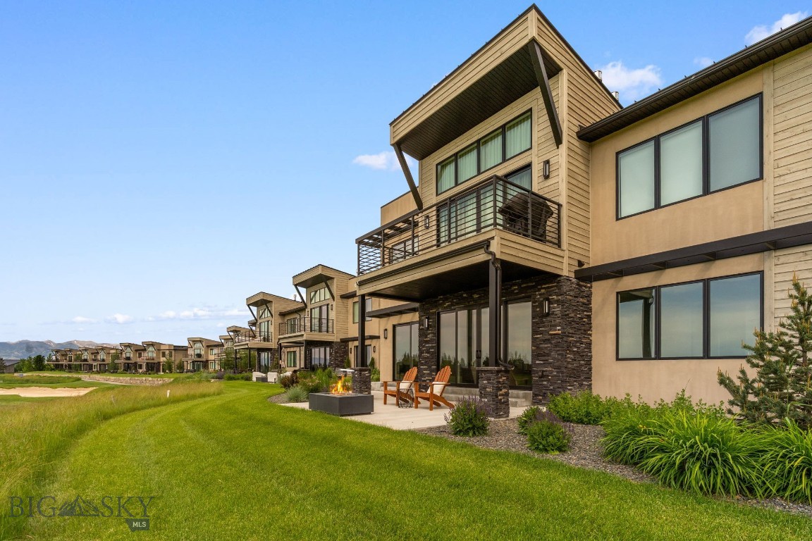 Welcome to 55 Ghost Horse Lane unit B, a beautiful unit located in the last building on the lane overlooking the 9th fairway of Black Bull. Enjoy expansive Bridger, Tobacco Root and Spanish Peaks views from the gas firepit on the patio. The open concept kitchen and living areas look onto the golf course from the floor to ceiling sliding glass doors in the living area as well as the primary bedroom. The kitchen boasts Thermador appliances, a massive center island, large pantry, a bar area with beverage fridge and high quality cabinets with pull-out drawers which provide ample storage space. There are two primary suites each with a private bathroom. The unit also includes a powder room, attached heated single car garage with drain, air conditioning, and a water softener. All this just a short walk to the Black Bull amenities which include a pool, fitness center, golf simulator and shop, cross country ski trails in the winter, walking trails and a stunning private restaurant with unobstructed Bridger views. Come see this beautiful unit for year round living or if you want to enjoy the lock & leave lifestyle. *Some photos are of club amenities.