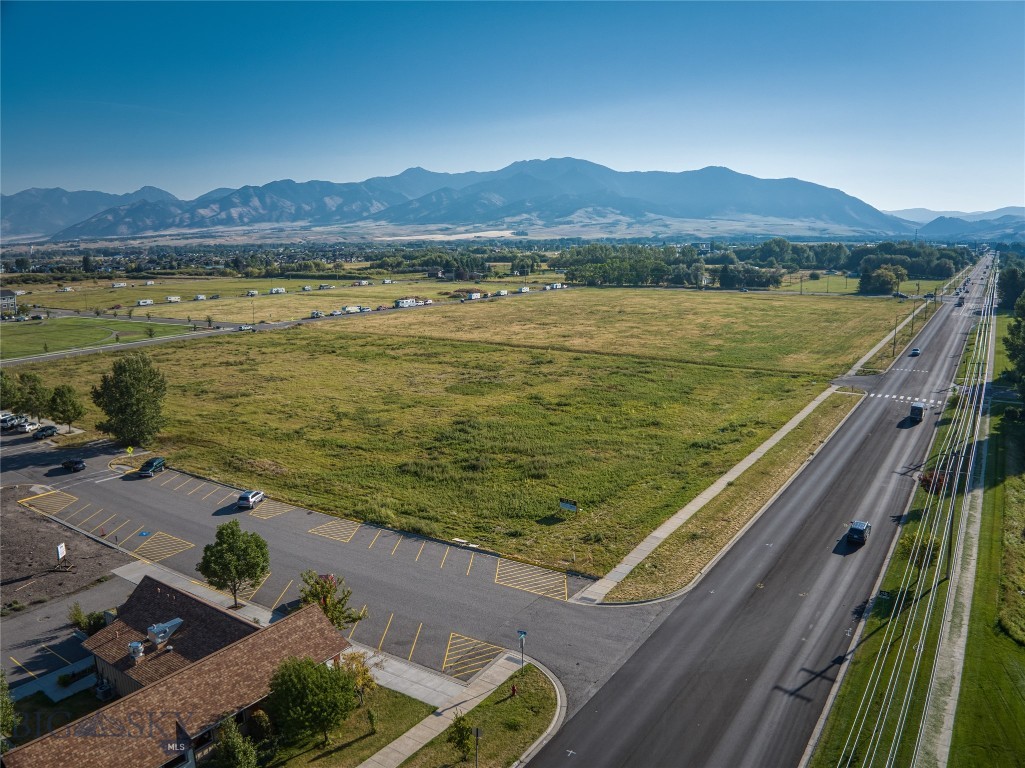 Located in Baxter Meadows, this 6.057-acre site is a prime infill development opportunity in the City of Bozeman. With 384 feet of frontage on Baxter Lane and Zoned B-2 (Community Business District), it is strategically positioned for many end-users. Baxter Lane is a highly trafficked arterial connecting Northwest Bozeman to Jackrabbit Lane with a 2023 AADT Traffic Count of 5,458 vehicles per day. The subject property can also be accessed from Caballo and Equestrian Lanes. Serviced by City Water/Sewer, this site is level, rectangular, utilities in the street, and near several multifamily, commercial, and single-family housing developments as well as Costco, Target, and I-90. This development site would be ideal for a variety of commercial development such as office, retail, restaurant, hotel, car wash (etc.) and/or multifamily. Bring your development dreams to fruition in this thriving area of Bozeman!